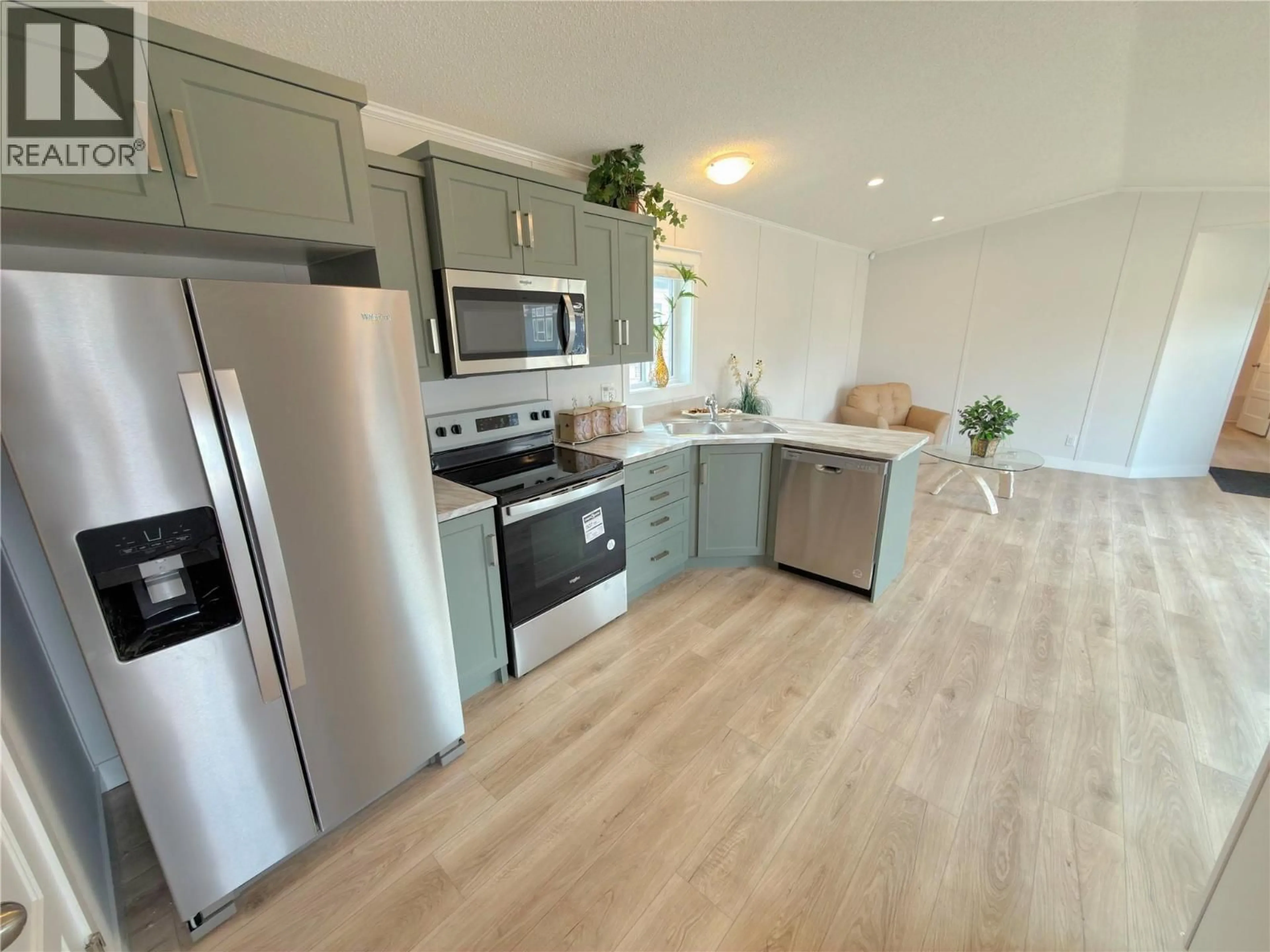 Open concept kitchen, wood/laminate floor for 7 - 406 BRANDLMAYR OTHER, Princeton British Columbia V0X1W0