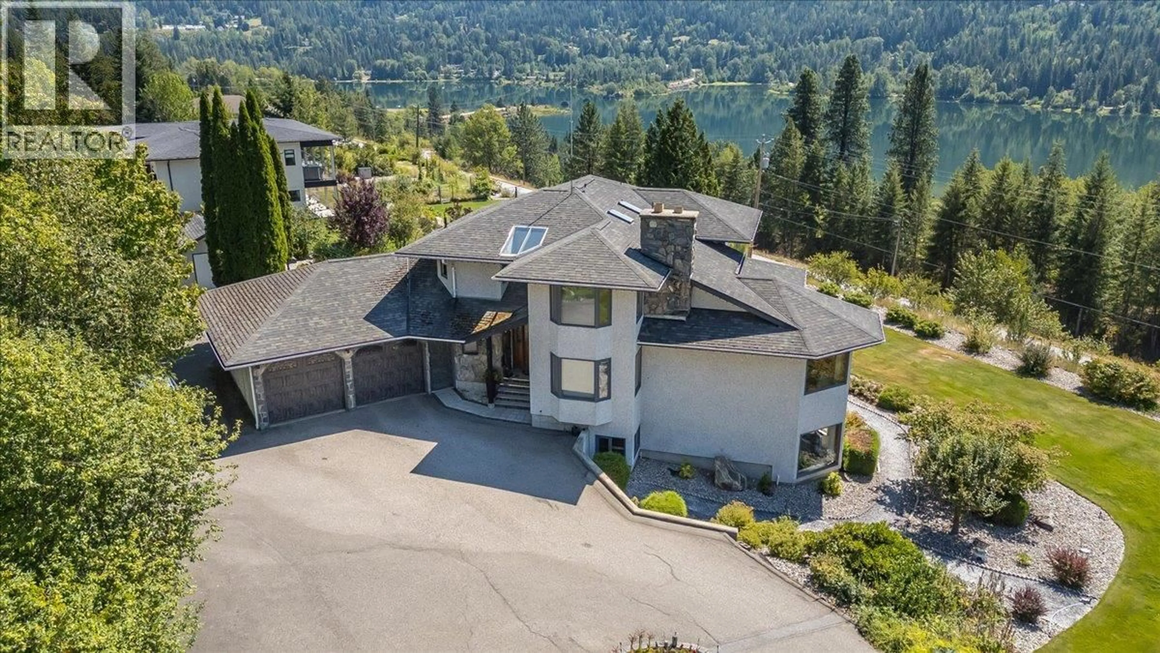 A pic from outside/outdoor area/front of a property/back of a property/a pic from drone, mountain view for 5725 TAGHUM FRONTAGE ROAD, Taghum British Columbia V1L6X9