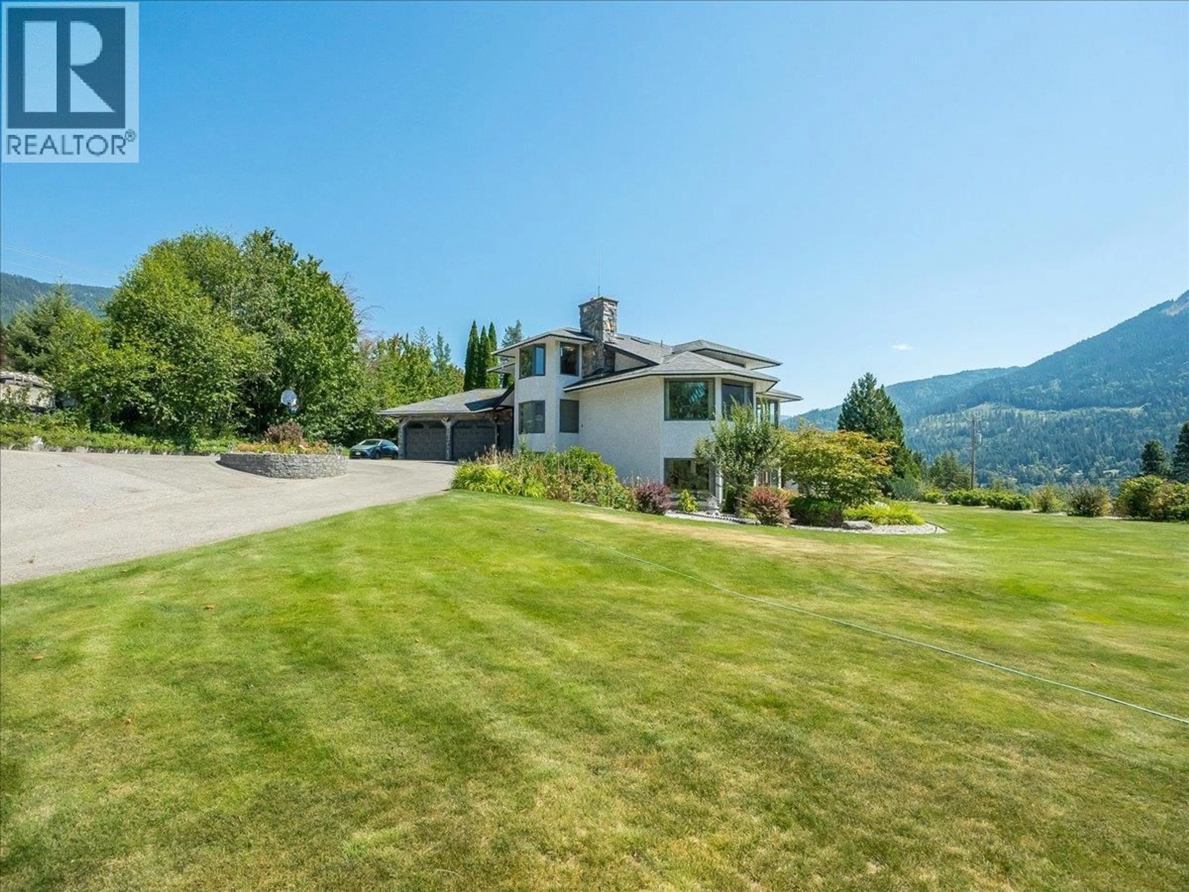 A pic from outside/outdoor area/front of a property/back of a property/a pic from drone, mountain view for 5725 TAGHUM FRONTAGE ROAD, Taghum British Columbia V1L6X9