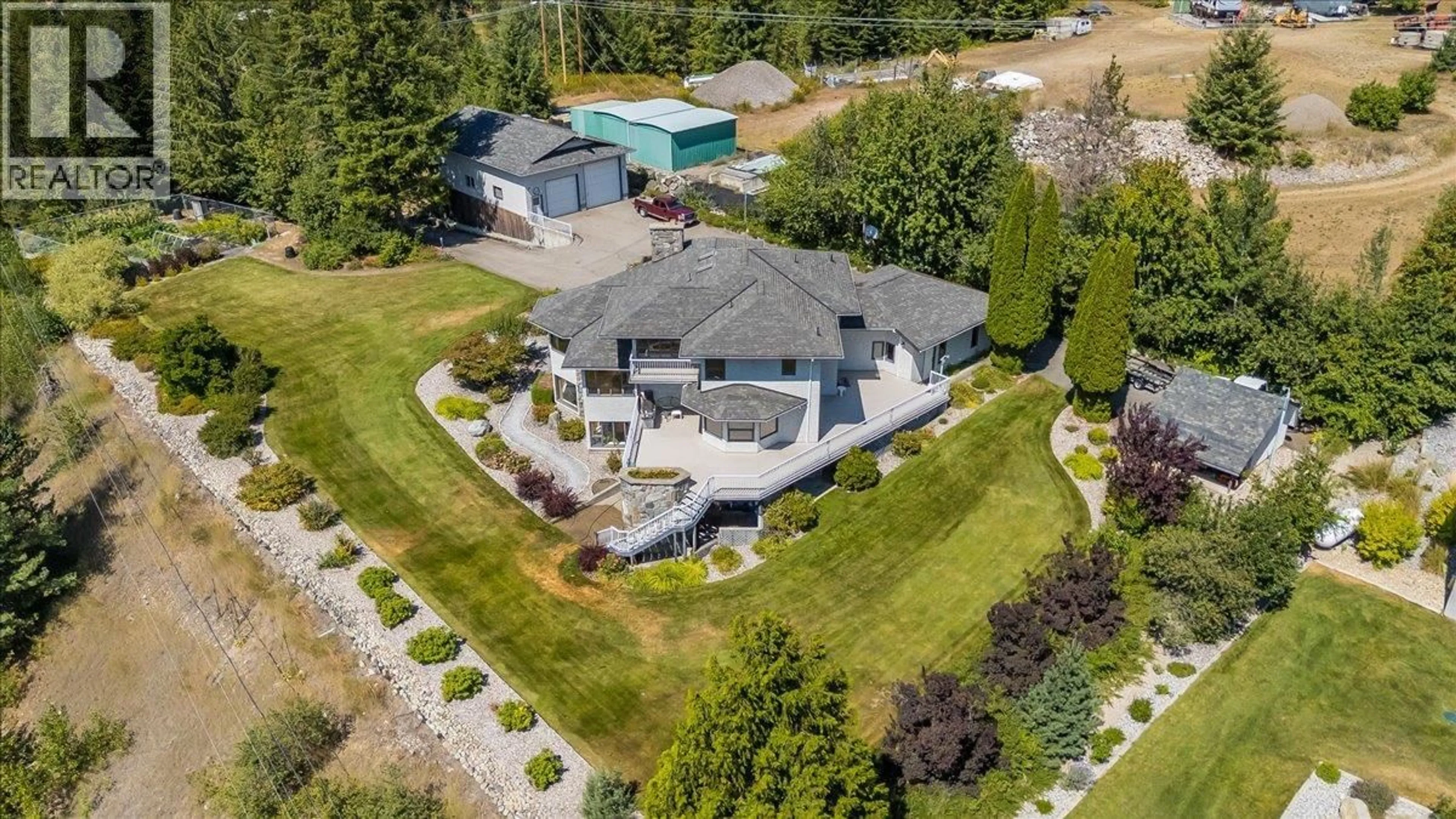 A pic from outside/outdoor area/front of a property/back of a property/a pic from drone, street for 5725 TAGHUM FRONTAGE ROAD, Taghum British Columbia V1L6X9