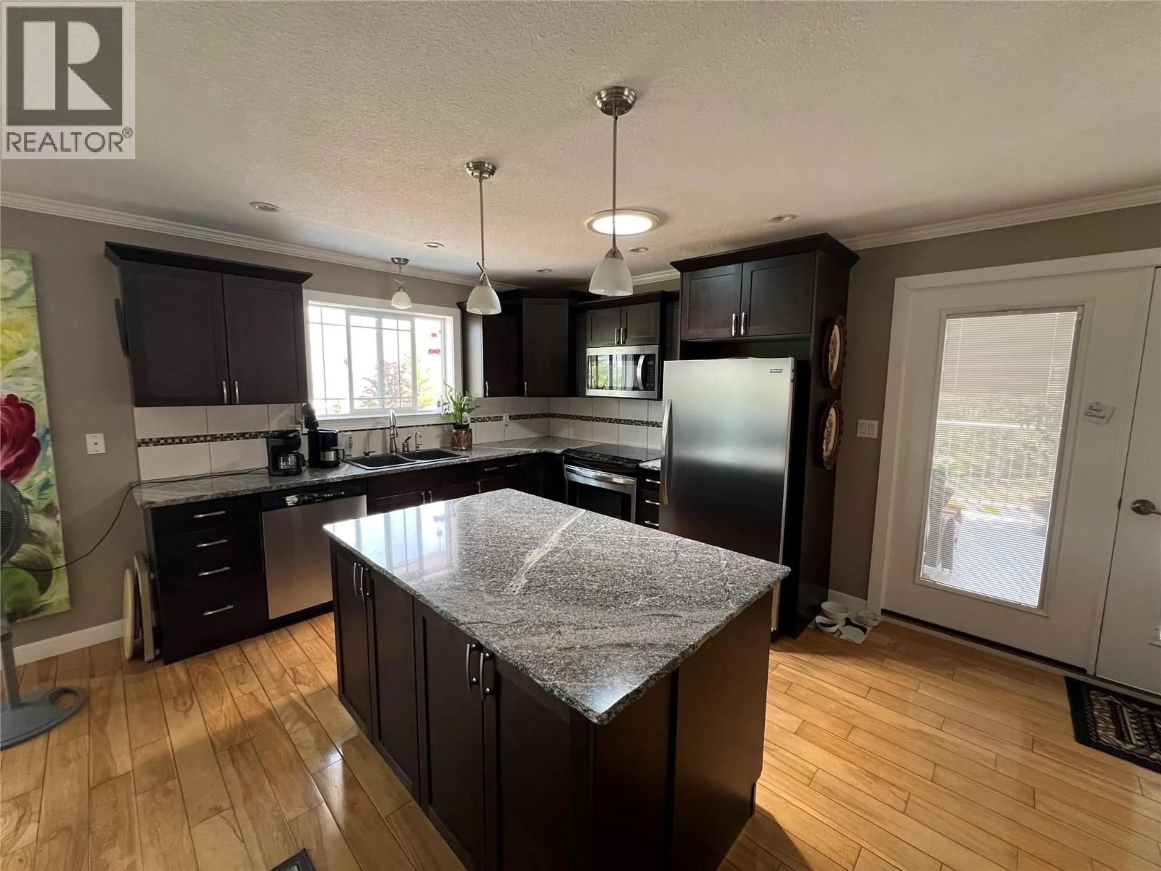 Open concept kitchen, wood/laminate floor for 3765 CRESTVIEW ROAD, Creston British Columbia V0B1G2