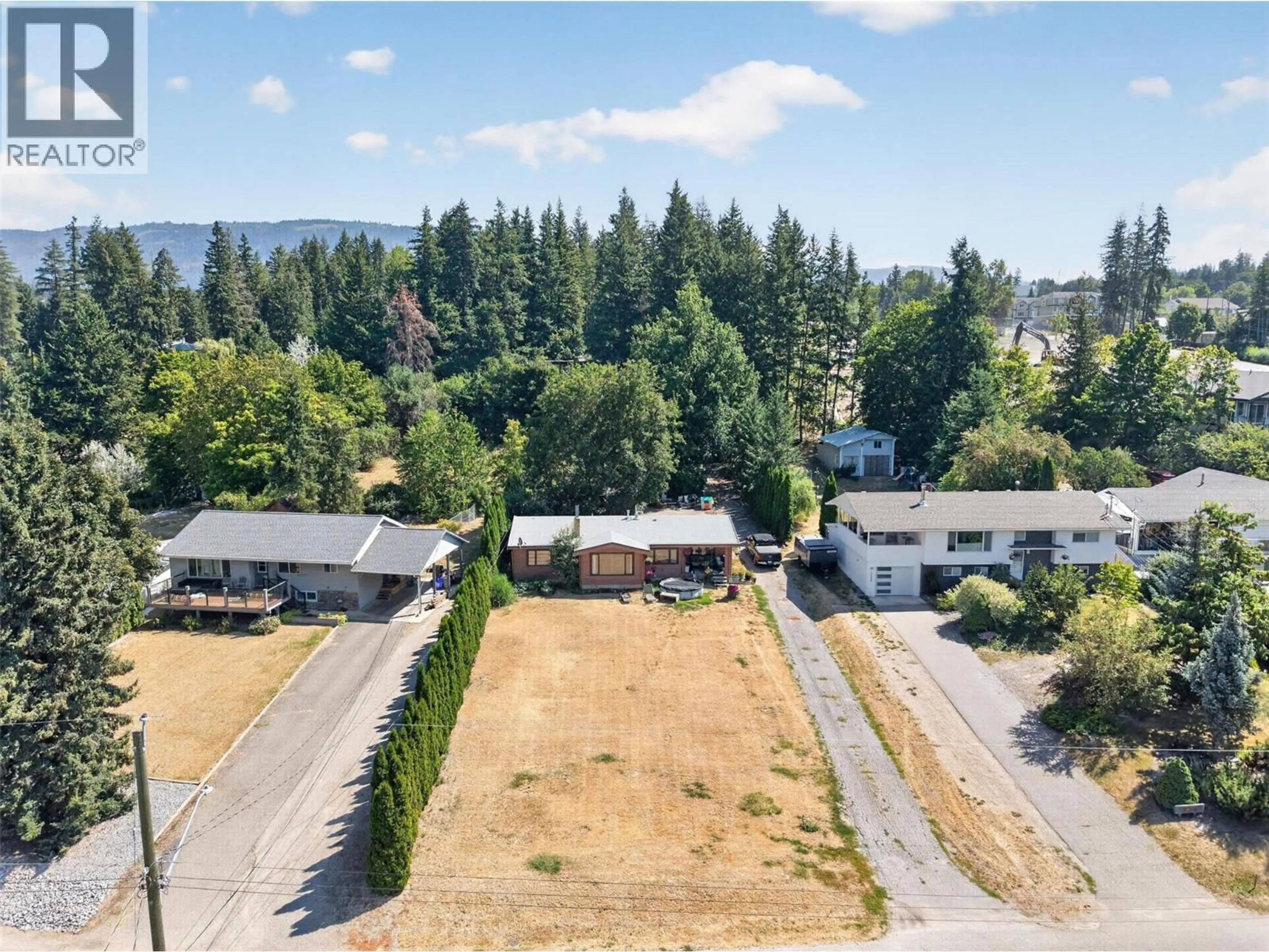 A pic from outside/outdoor area/front of a property/back of a property/a pic from drone, unknown for 1260 16 STREET NORTHEAST, Salmon Arm British Columbia V1E2V1