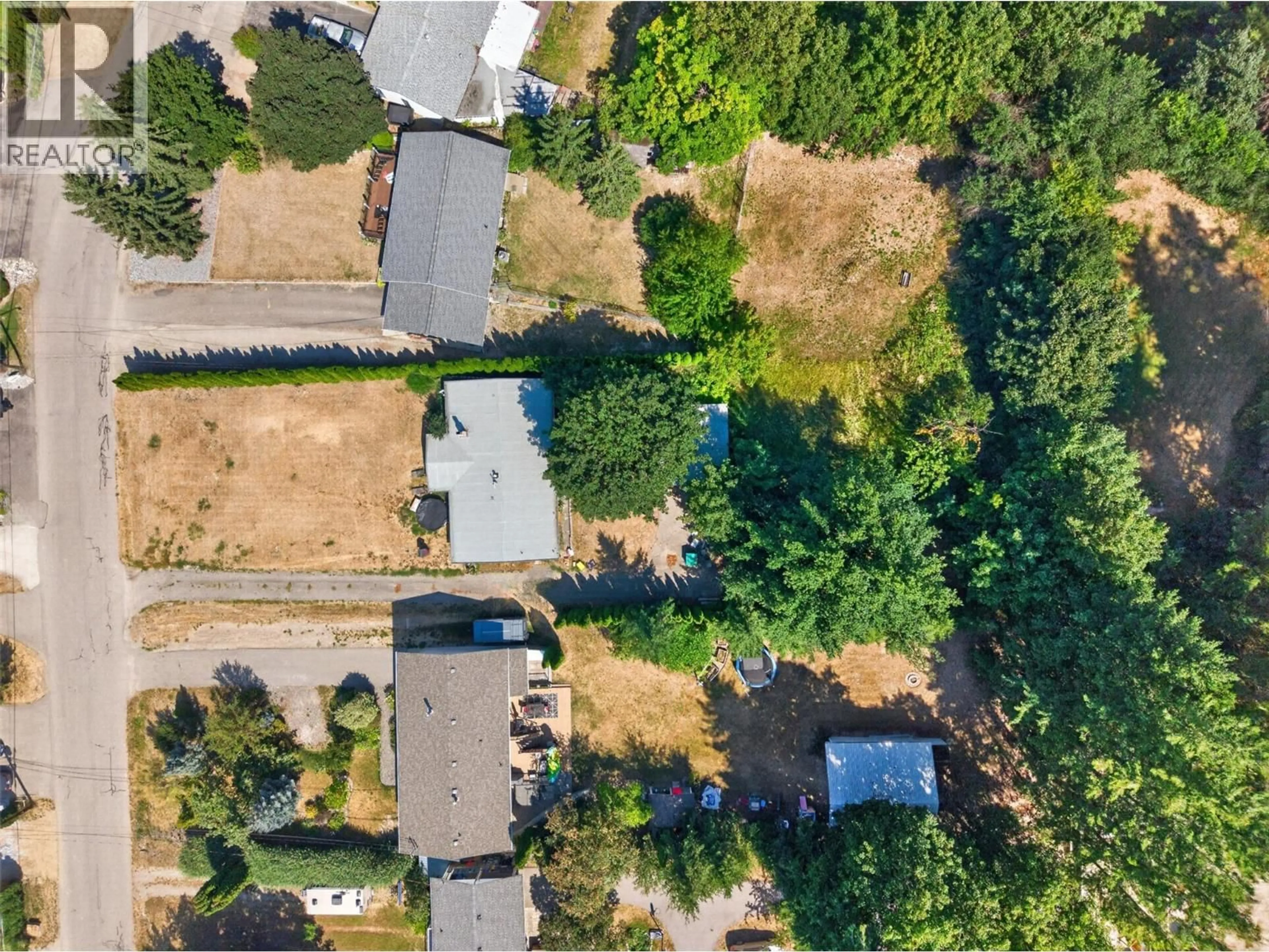 A pic from outside/outdoor area/front of a property/back of a property/a pic from drone, street for 1260 16 STREET NORTHEAST, Salmon Arm British Columbia V1E2V1