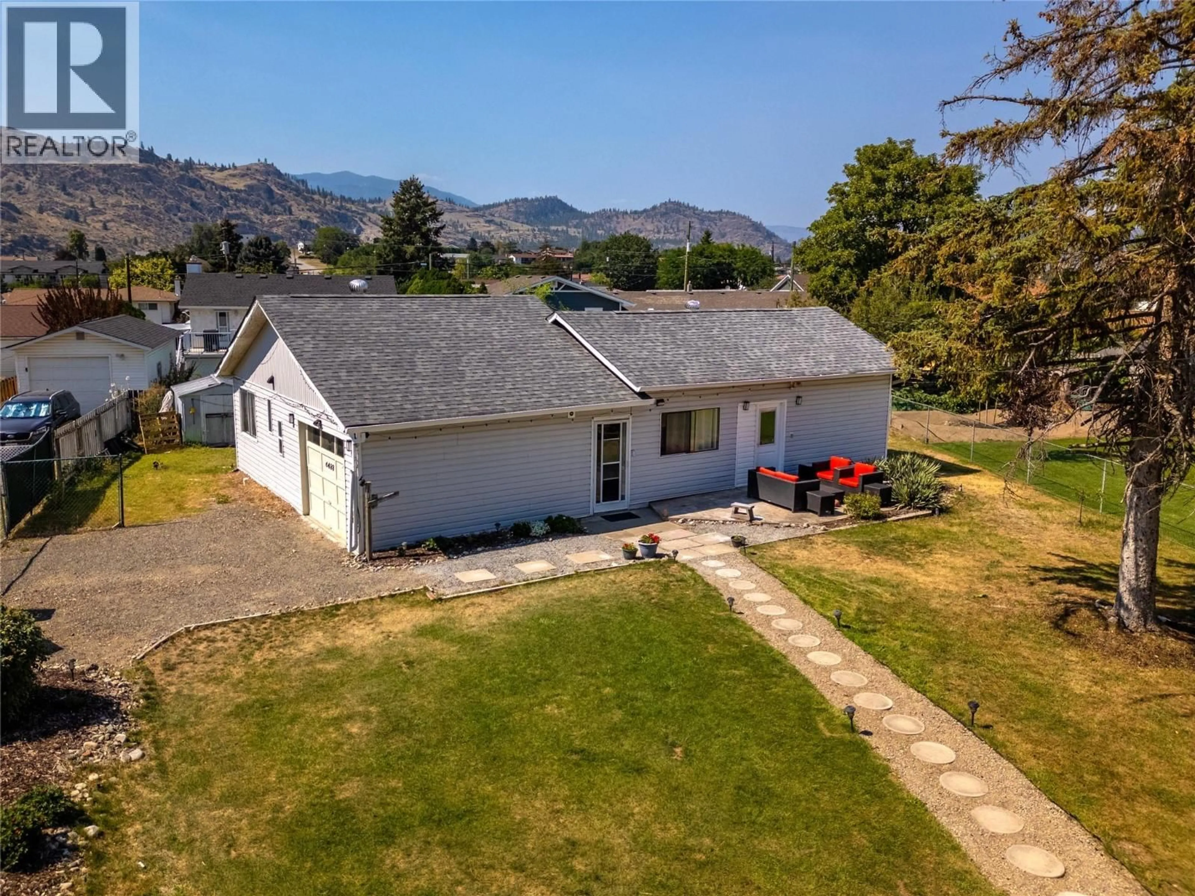 A pic from outside/outdoor area/front of a property/back of a property/a pic from drone, mountain view for 6488 WOLFCUB PLACE PLACE, Oliver British Columbia V0H1T3