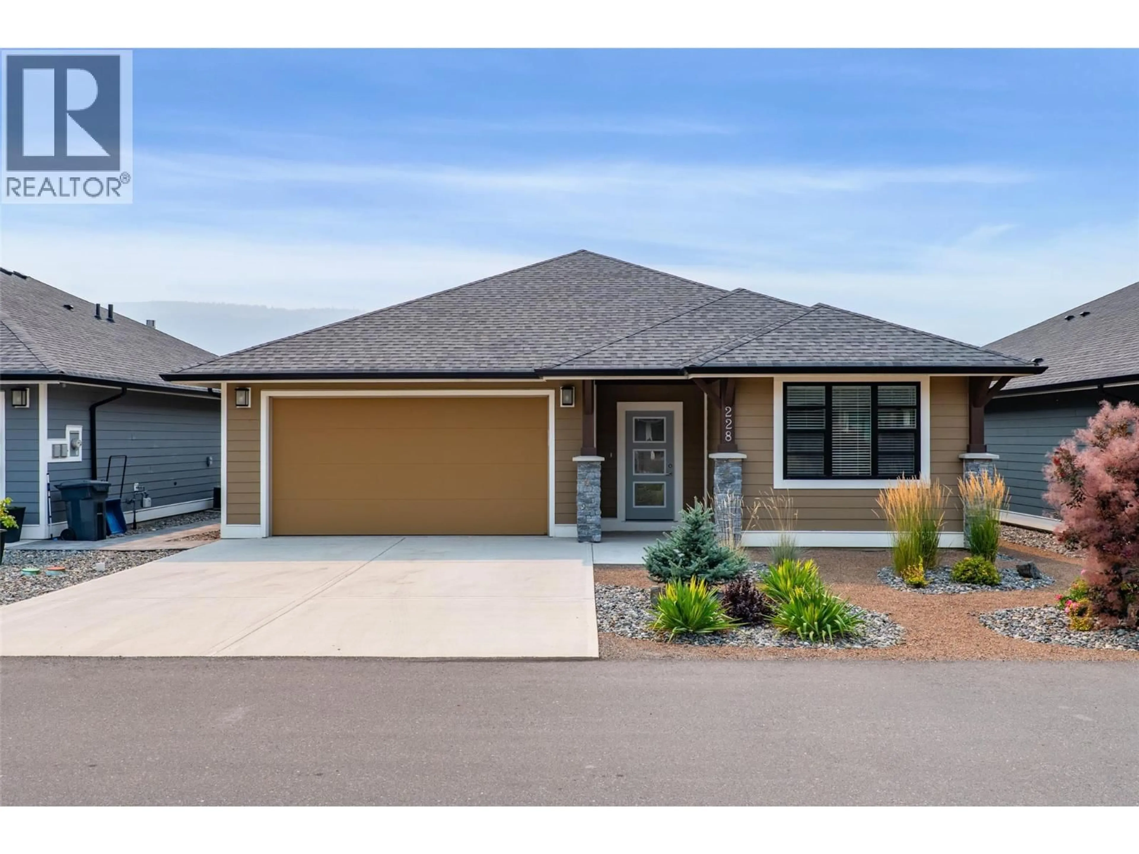 Home with brick exterior material, street for 228 - 641 SHUSWAP ROAD EAST, Kamloops British Columbia V2H0E2