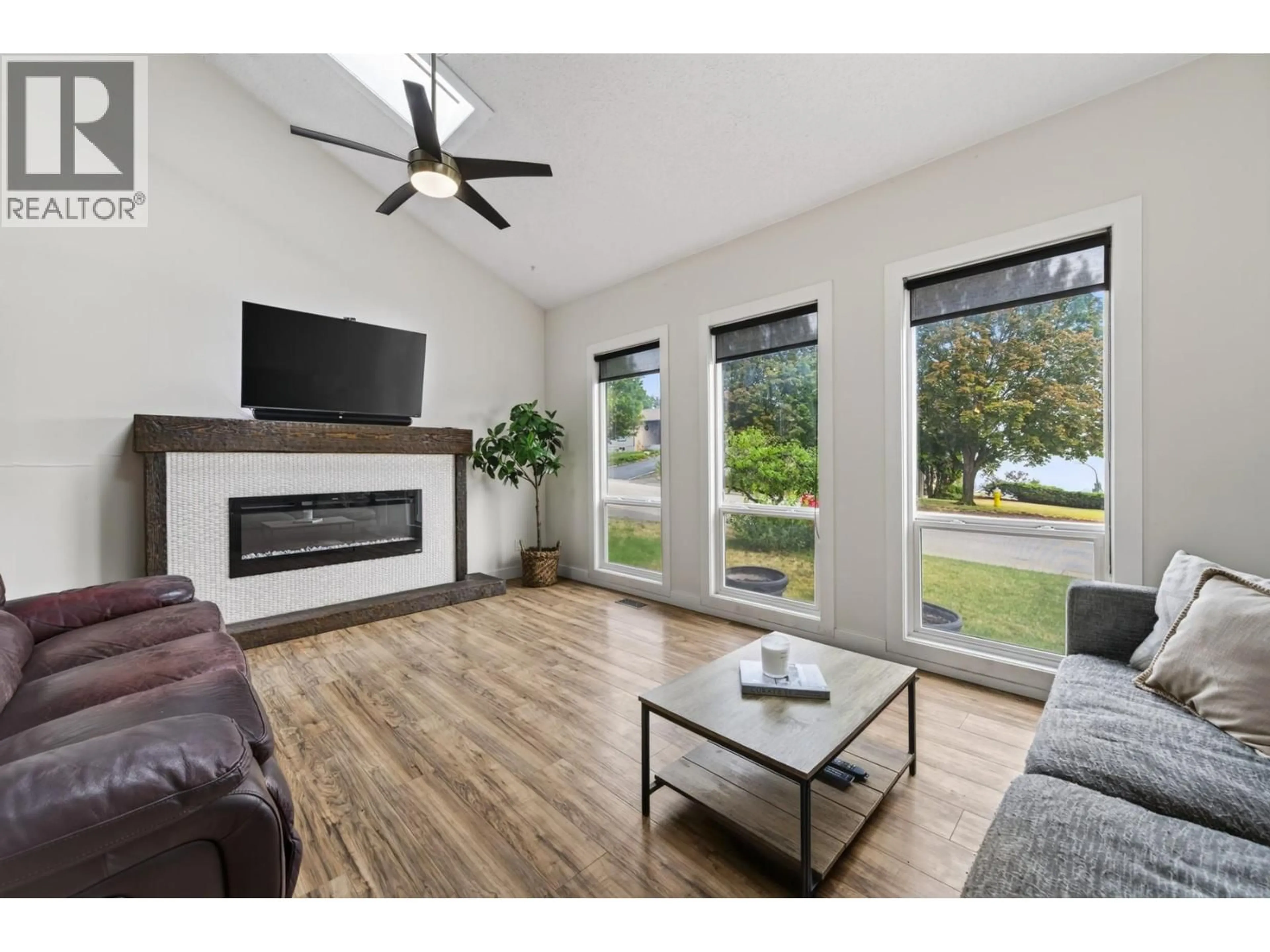Living room with furniture, wood/laminate floor for 455 LAURIER DRIVE, Kamloops British Columbia V1S1C2