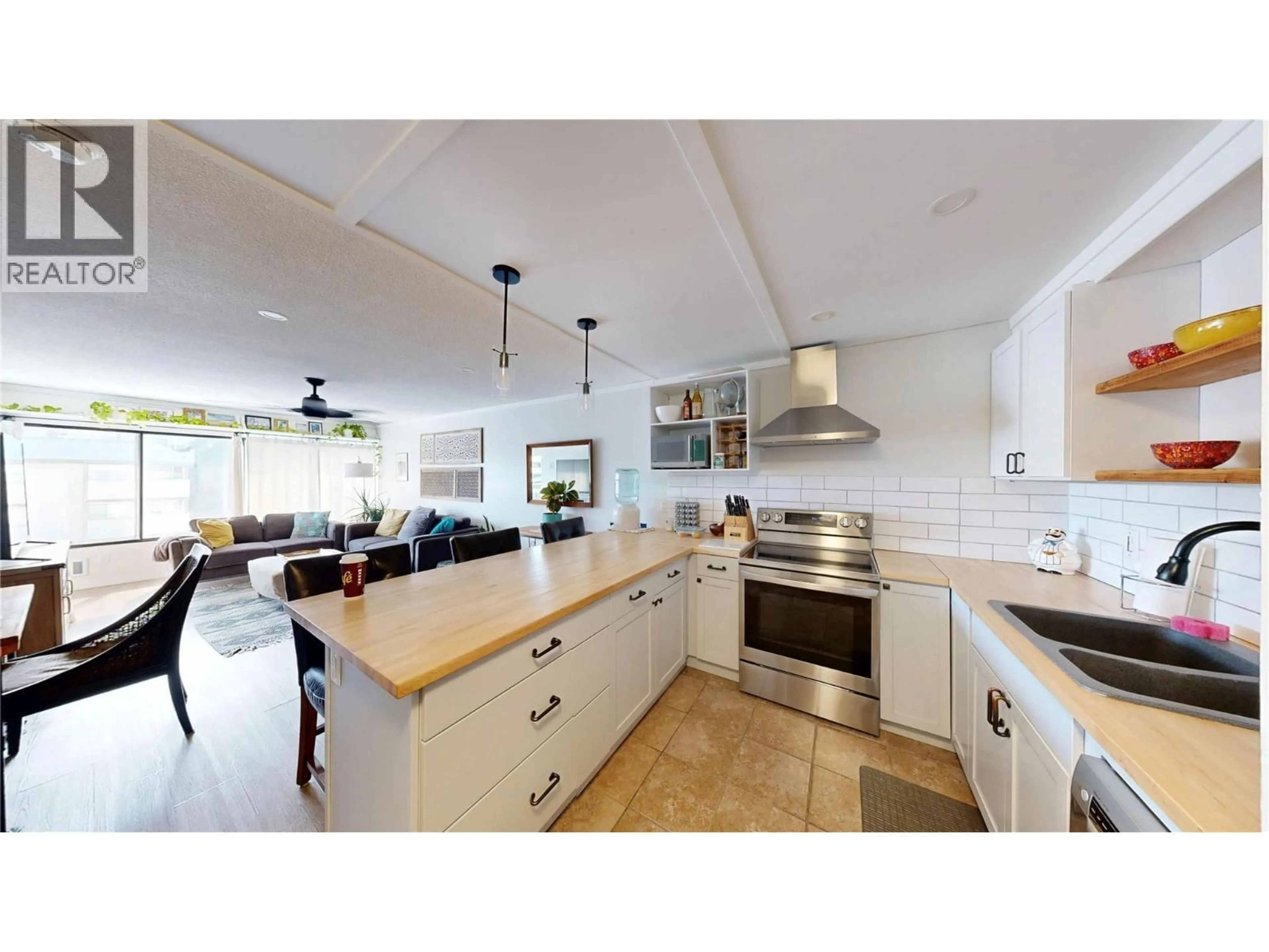 Open concept kitchen, ceramic/tile floor for 406 - 737 LEON AVENUE, Kelowna British Columbia V1Y8L6