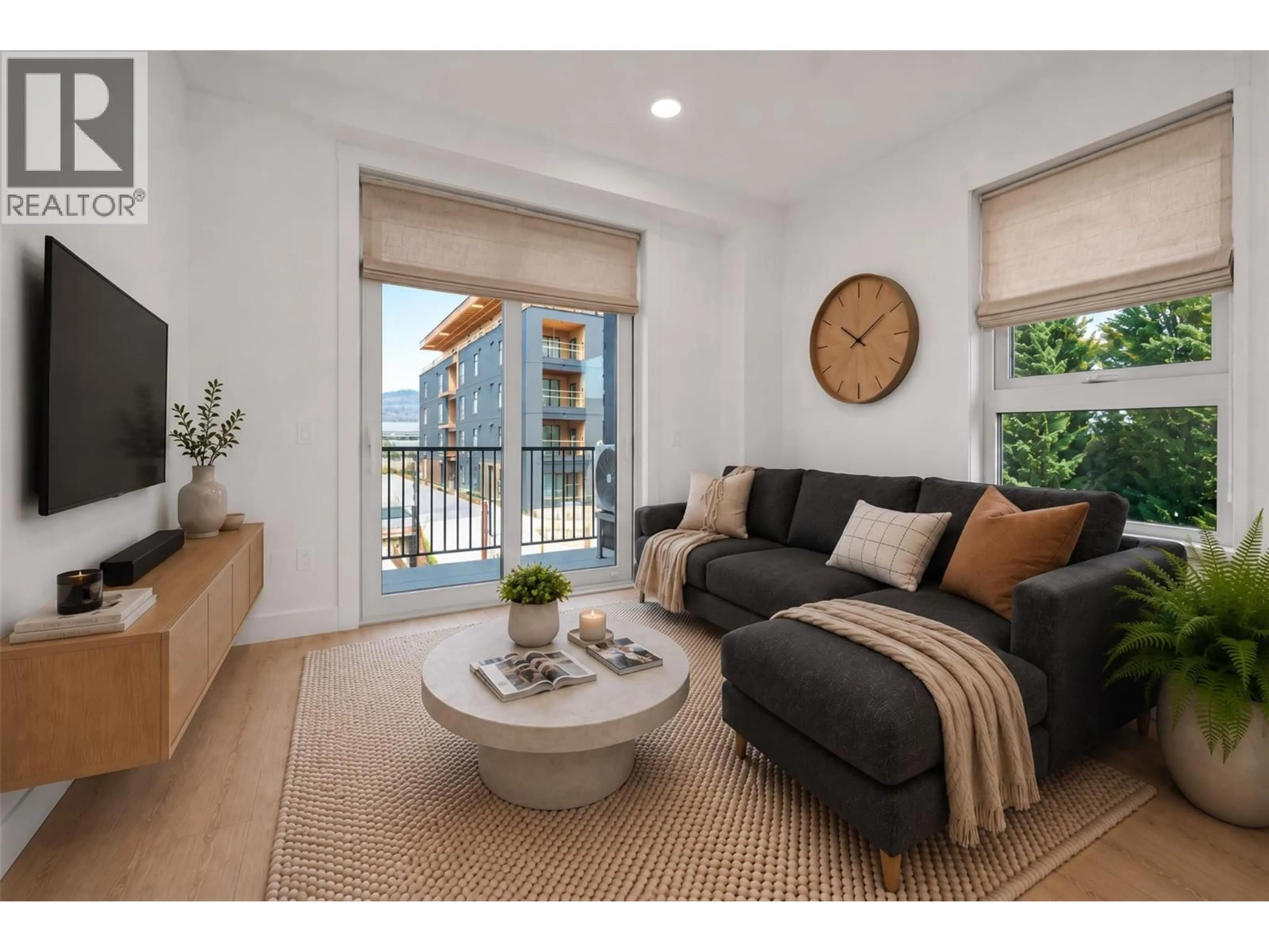Living room with furniture, wood/laminate floor for 312 - 620 CORONATION AVENUE, Kelowna British Columbia V1Y7A1