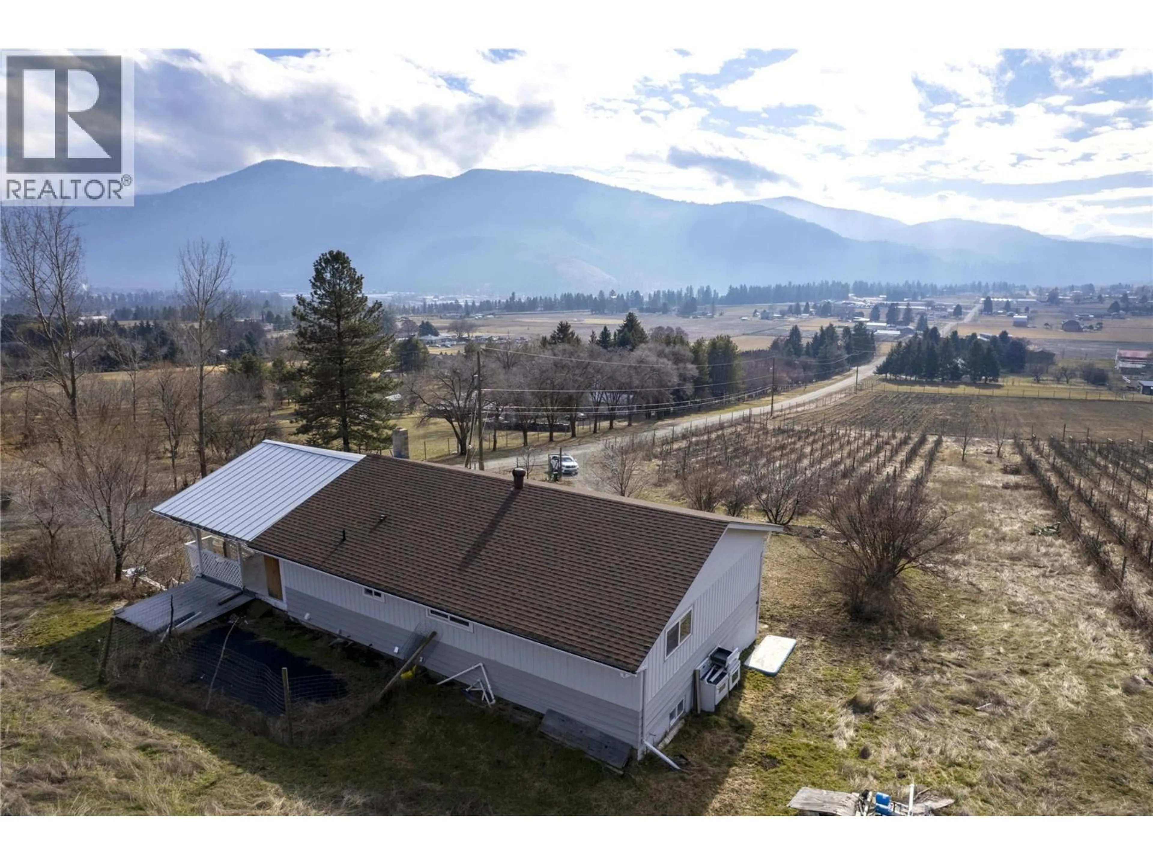 A pic from outside/outdoor area/front of a property/back of a property/a pic from drone, mountain view for 6805 RESERVOIR ROAD, Grand Forks British Columbia V0H1H5