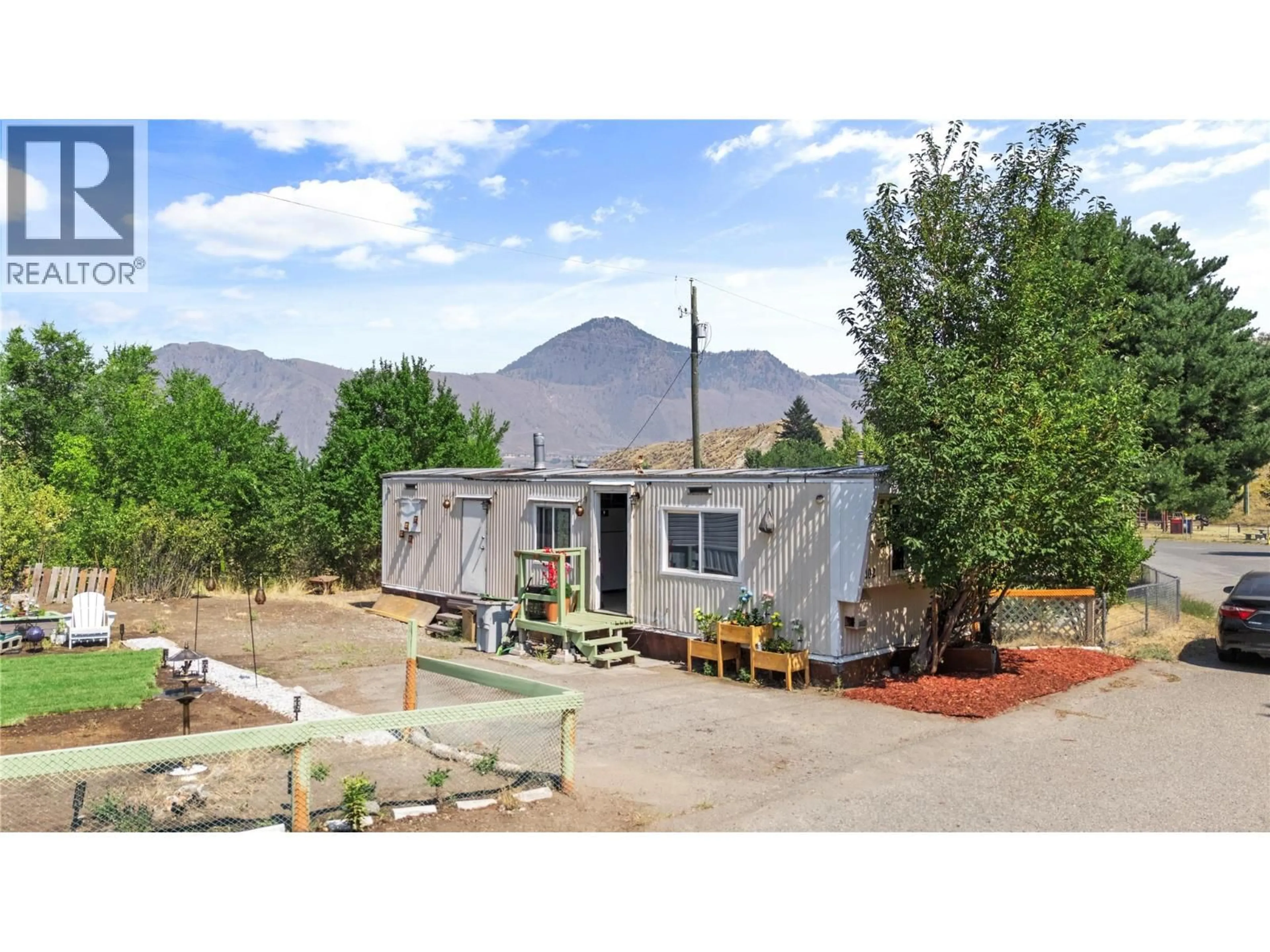 A pic from outside/outdoor area/front of a property/back of a property/a pic from drone, mountain view for 102 - 1175 ROSE HILL ROAD, Kamloops British Columbia V2E1G9