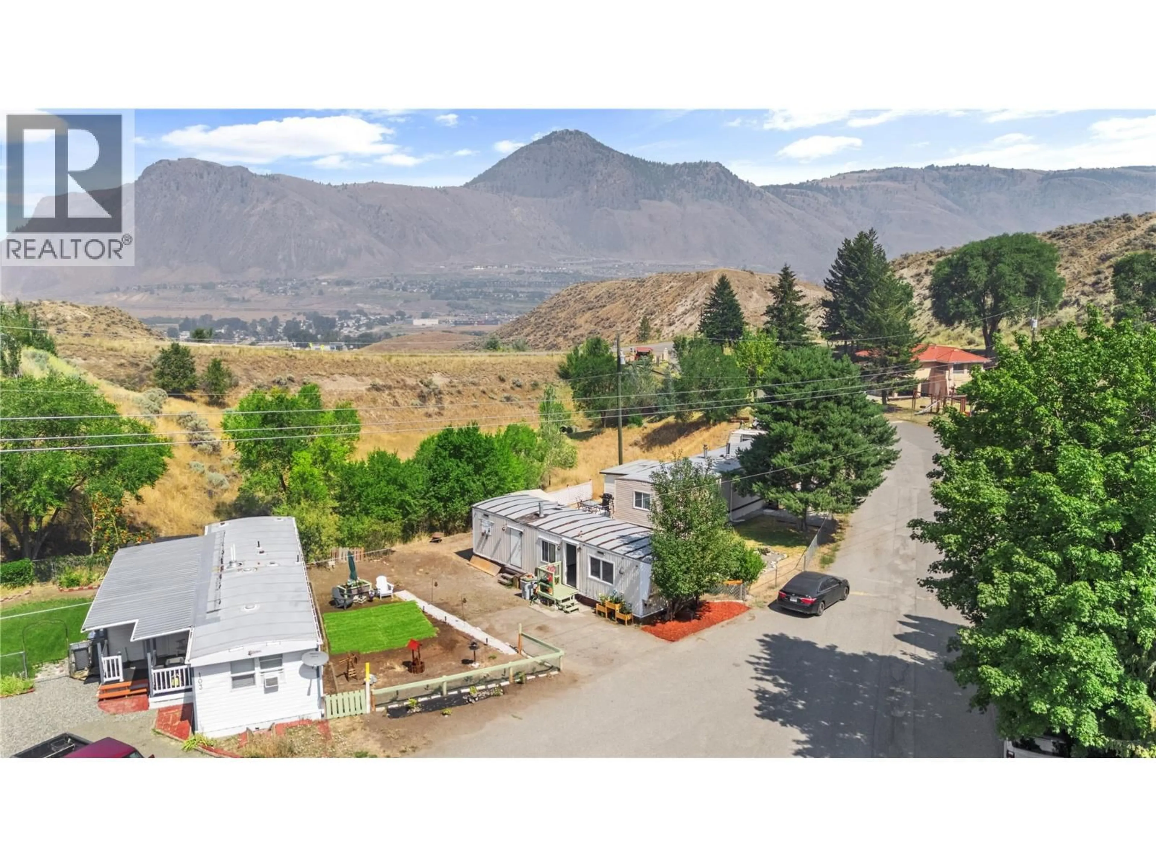 A pic from outside/outdoor area/front of a property/back of a property/a pic from drone, mountain view for 102 - 1175 ROSE HILL ROAD, Kamloops British Columbia V2E1G9