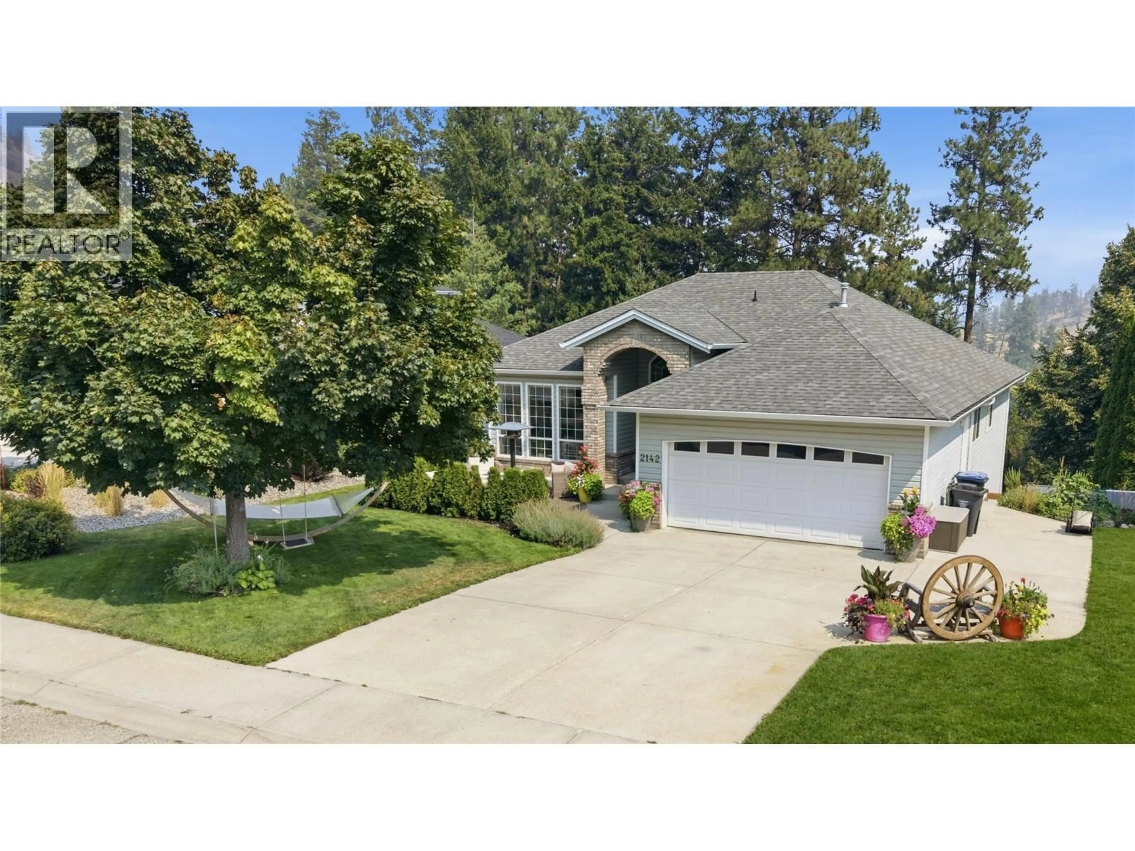 Home with vinyl exterior material, street for 2142 SHANNON WOODS WAY, West Kelowna British Columbia V4T2R5