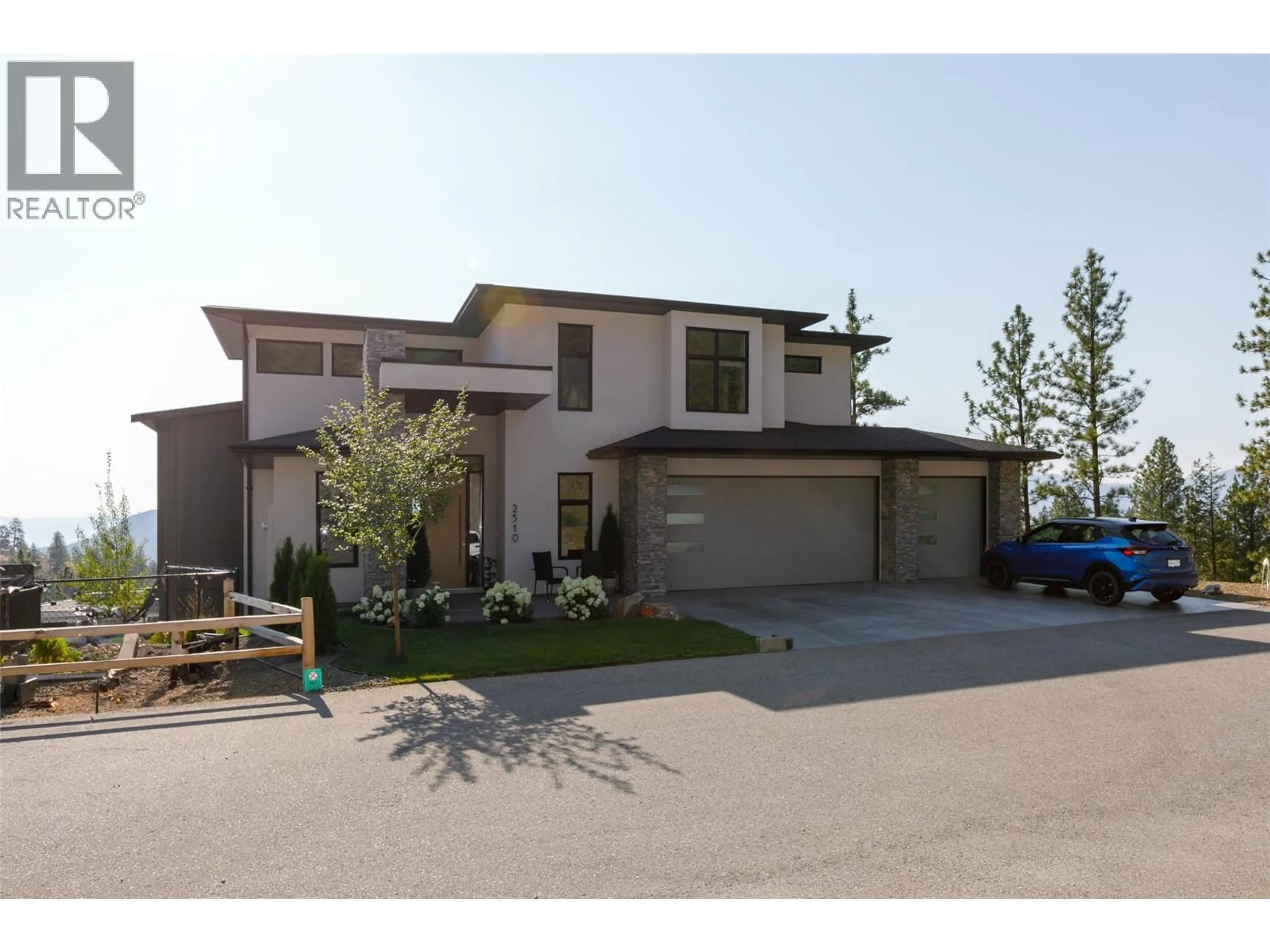 Home with brick exterior material, street for 2510 TALLUS HEIGHTS LANE, West Kelowna British Columbia V4T3M2
