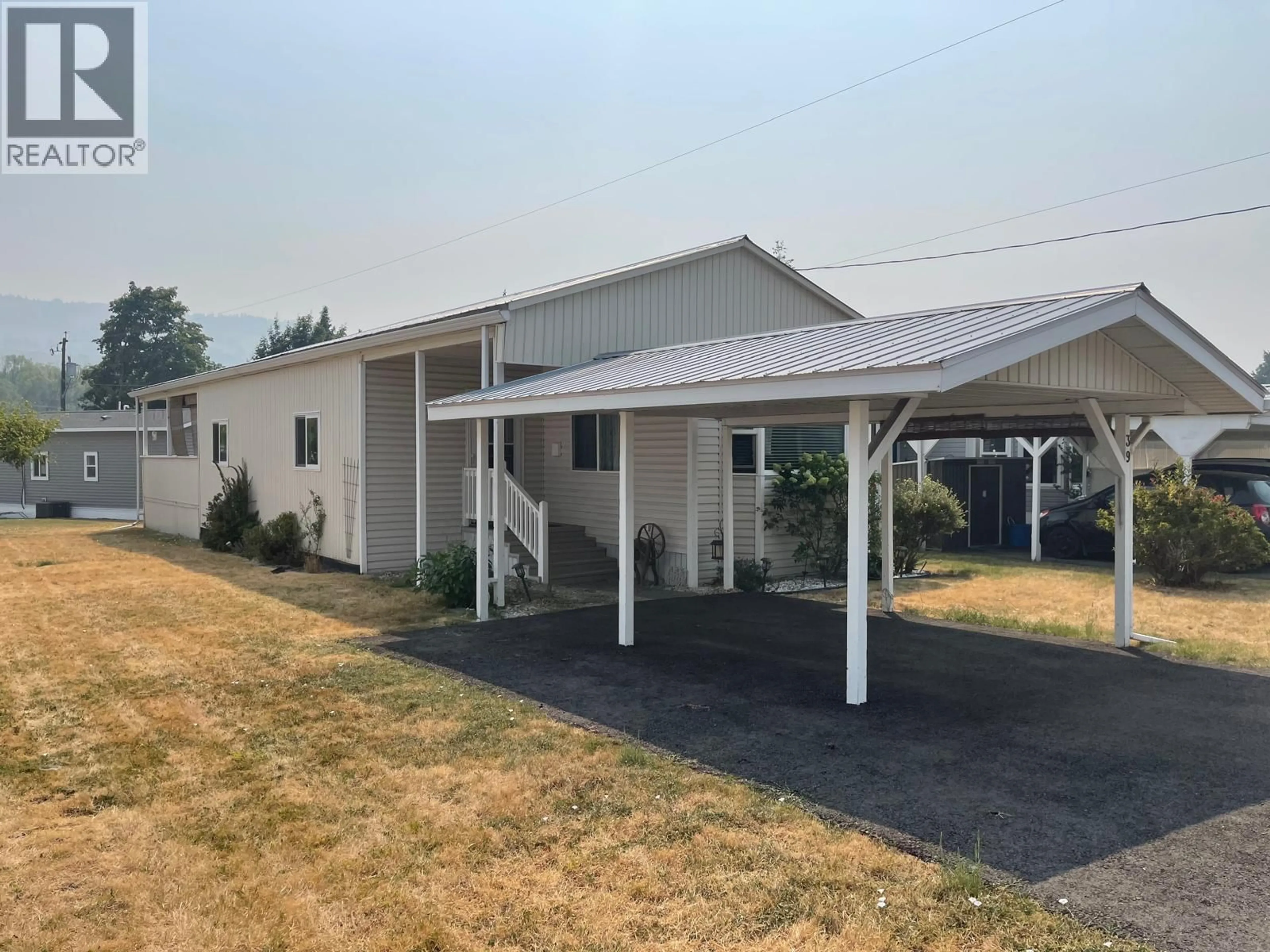 Home with vinyl exterior material, street for 39 - 5484 25 AVENUE, Vernon British Columbia V1T7A8