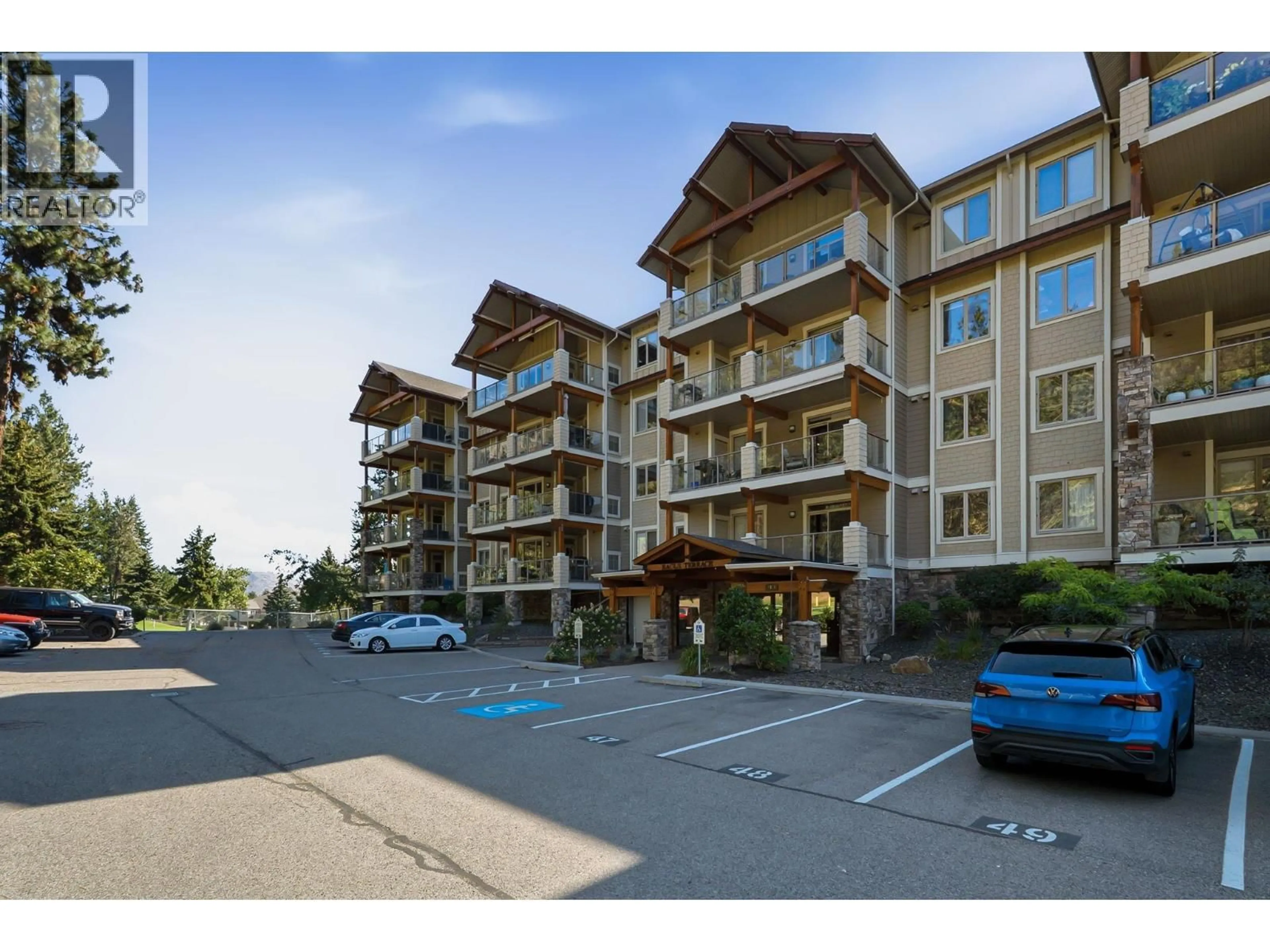 A pic from outside/outdoor area/front of a property/back of a property/a pic from drone, mountain view for 103 - 2470 TUSCANY DRIVE, West Kelowna British Columbia V4T3G8