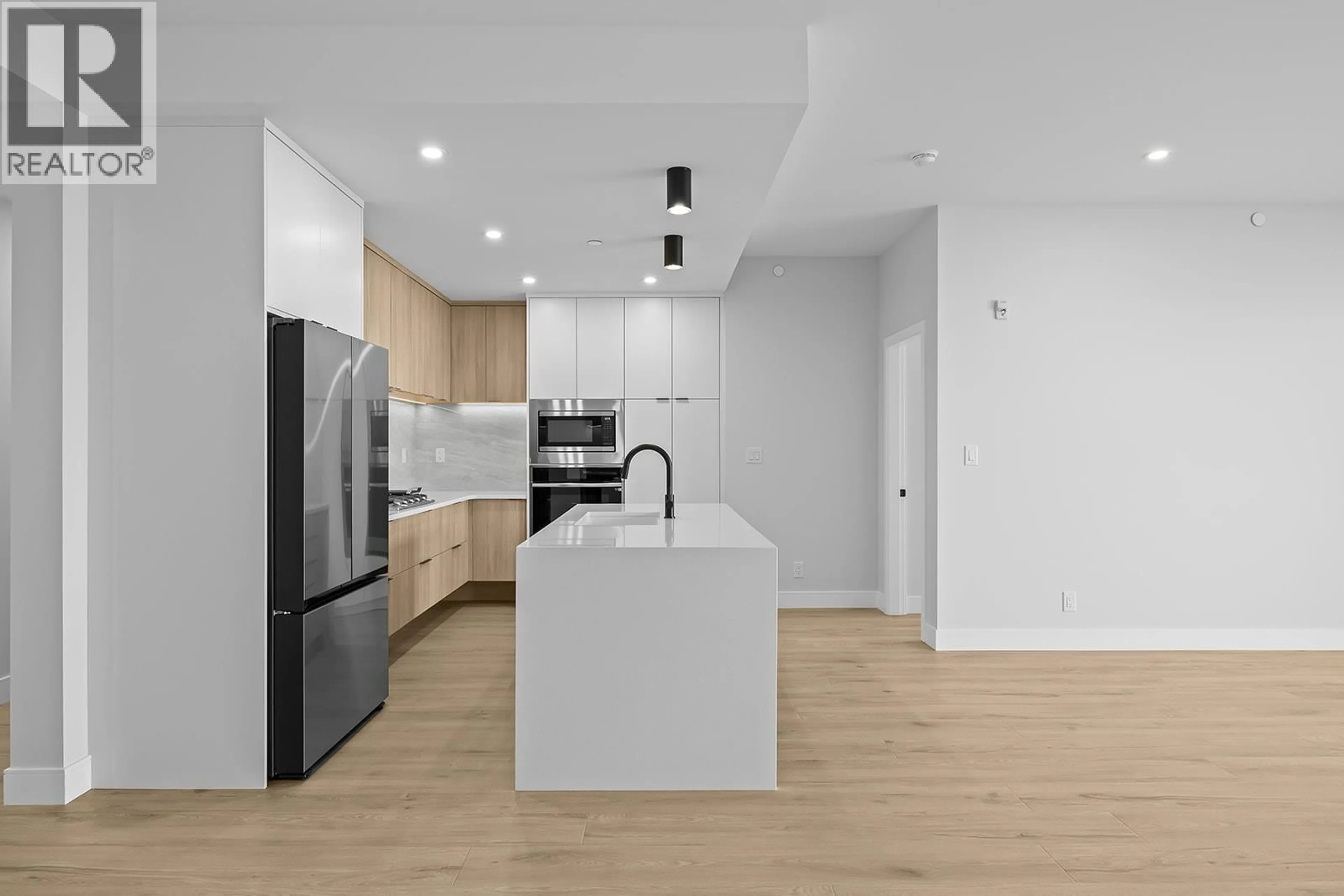 Open concept kitchen, unknown for 301 - 75 PREDATOR RIDGE DRIVE, Vernon British Columbia V1H1G4