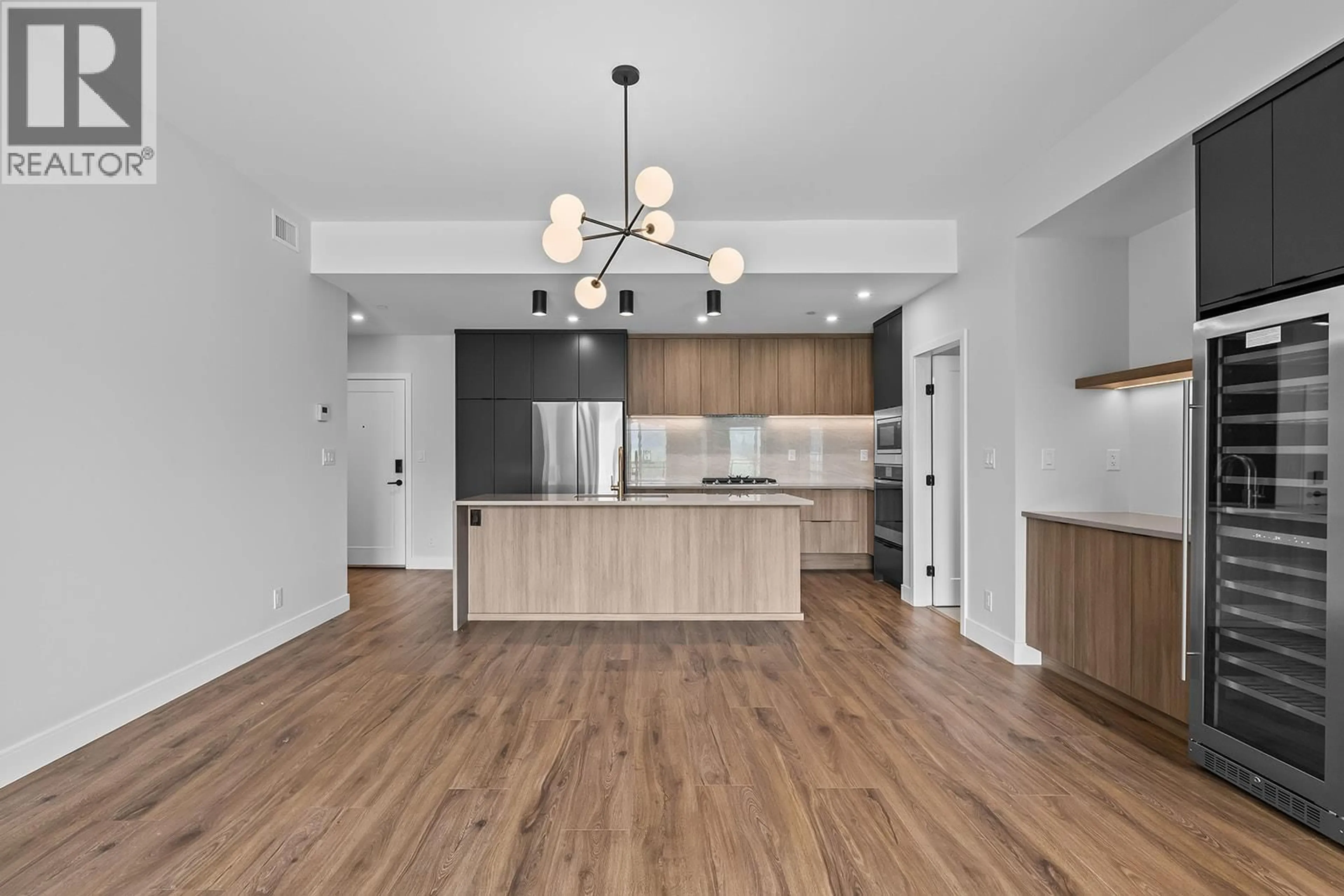 Open concept kitchen, unknown for 307 - 75 PREDATOR RIDGE DRIVE, Vernon British Columbia V1H1G4