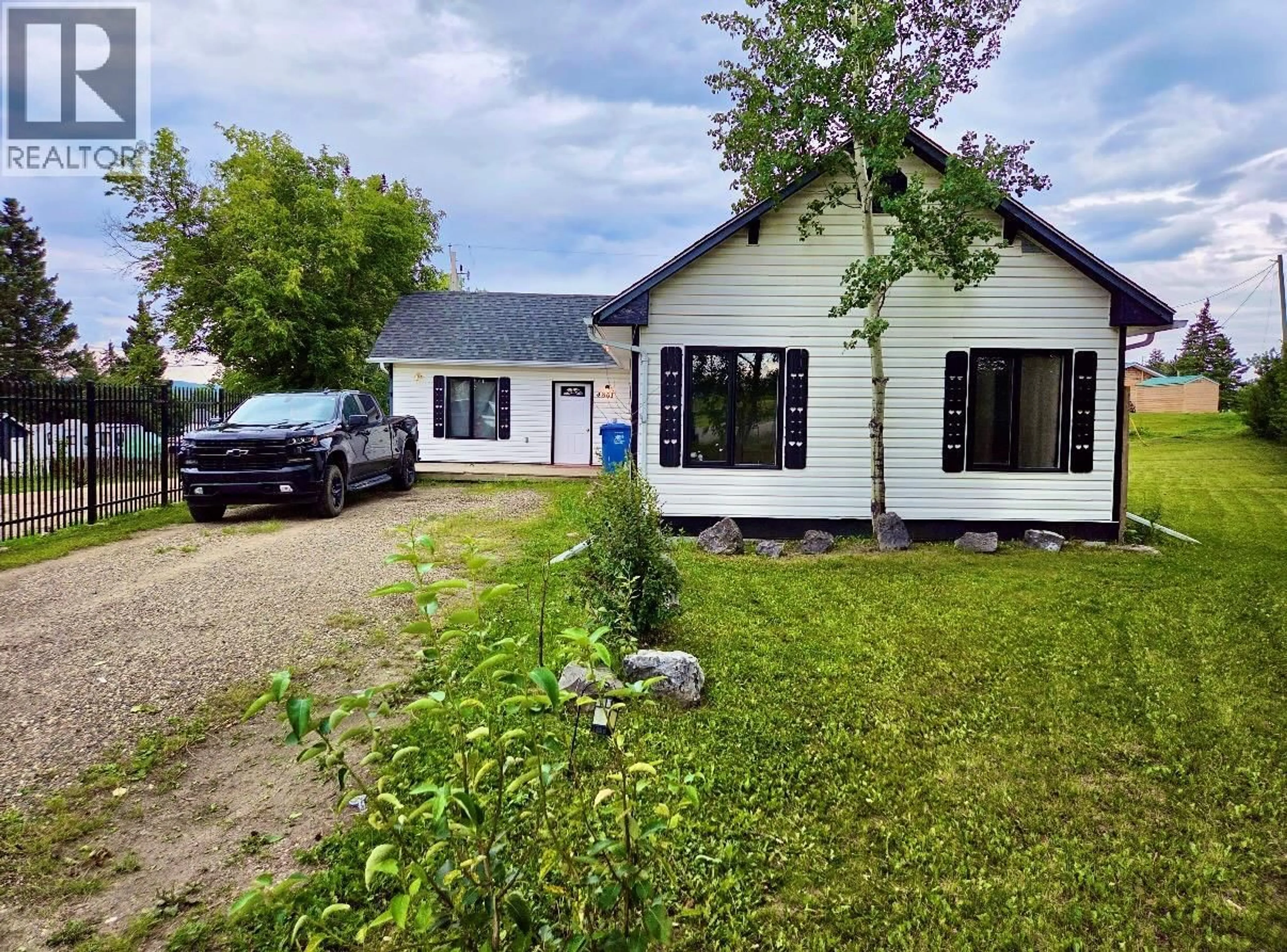 A pic from outside/outdoor area/front of a property/back of a property/a pic from drone, street for 4801 50 AVENUE, Pouce Coupe British Columbia V0C2C0
