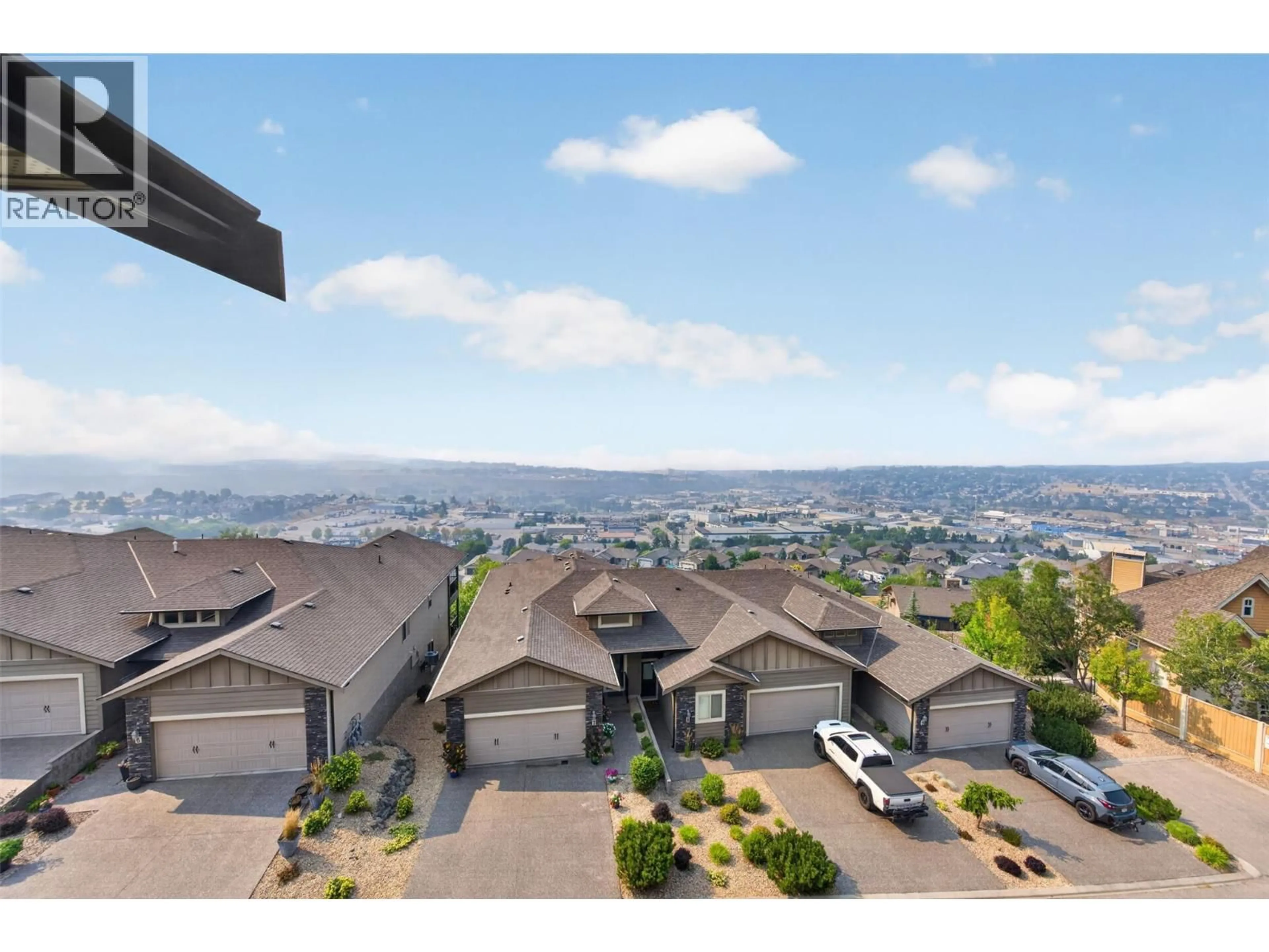 A pic from outside/outdoor area/front of a property/back of a property/a pic from drone, mountain view for 14 - 1040 MT REVELSTOKE PLACE, Vernon British Columbia V1B4E3