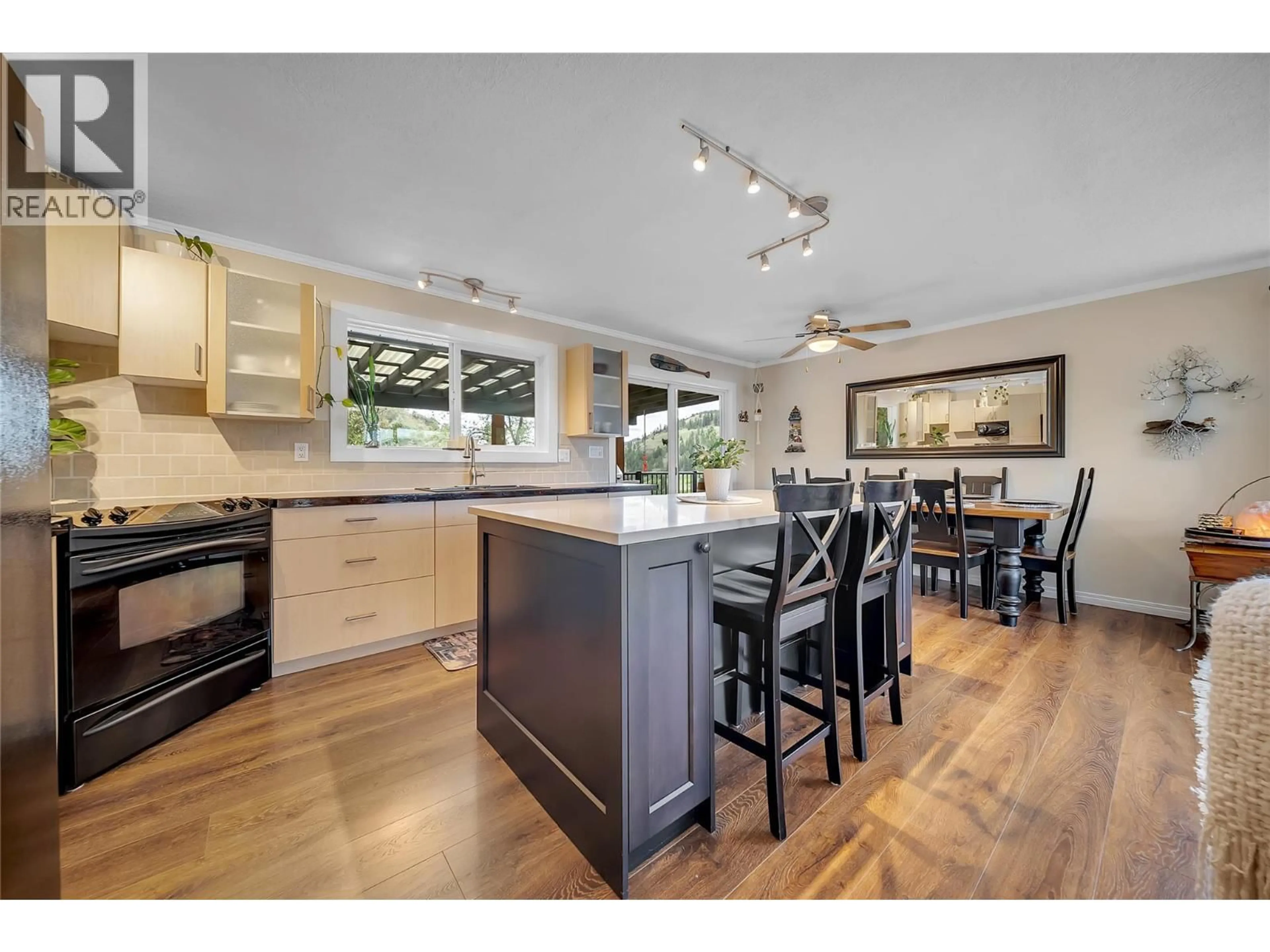 Open concept kitchen, wood/laminate floor for 20177 GARNET VALLEY ROAD, Summerland British Columbia V0H1Z3
