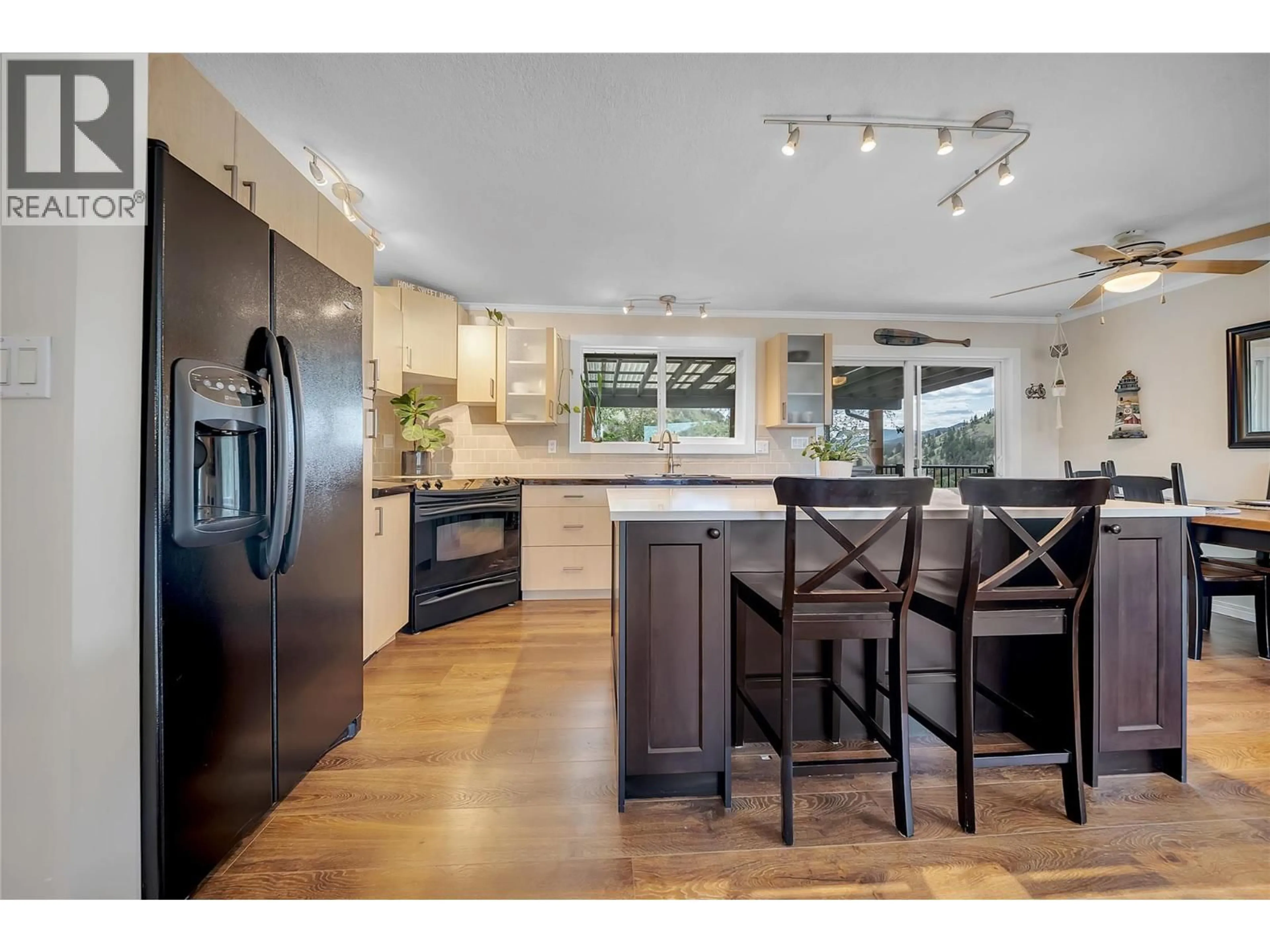 Open concept kitchen, wood/laminate floor for 20177 GARNET VALLEY ROAD, Summerland British Columbia V0H1Z3