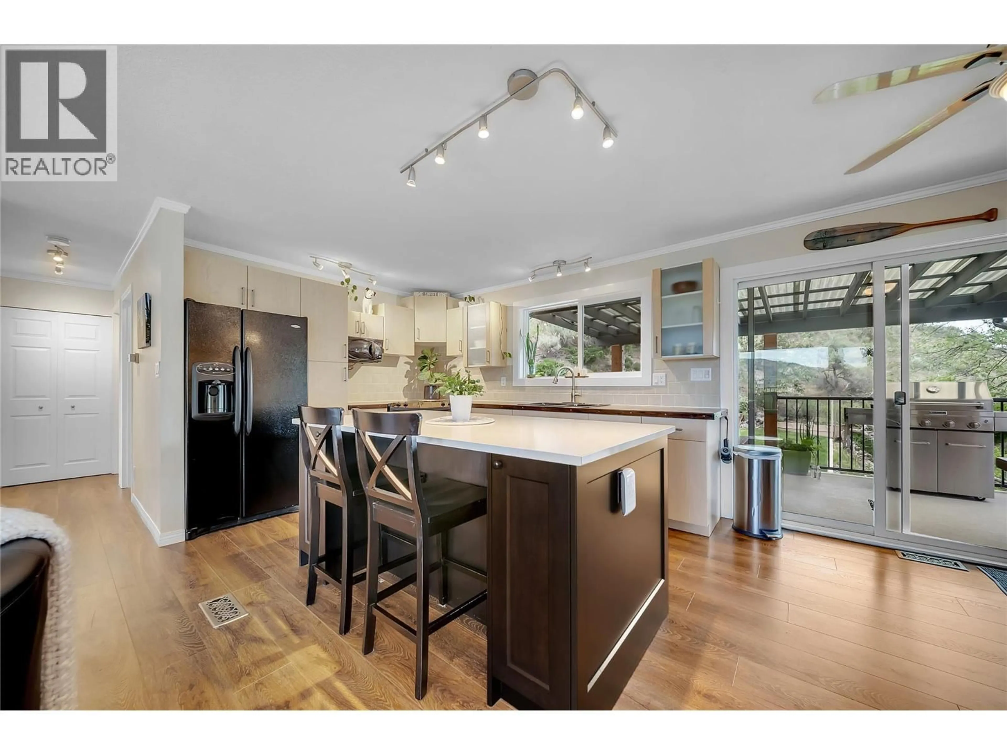 Open concept kitchen, wood/laminate floor for 20177 GARNET VALLEY ROAD, Summerland British Columbia V0H1Z3
