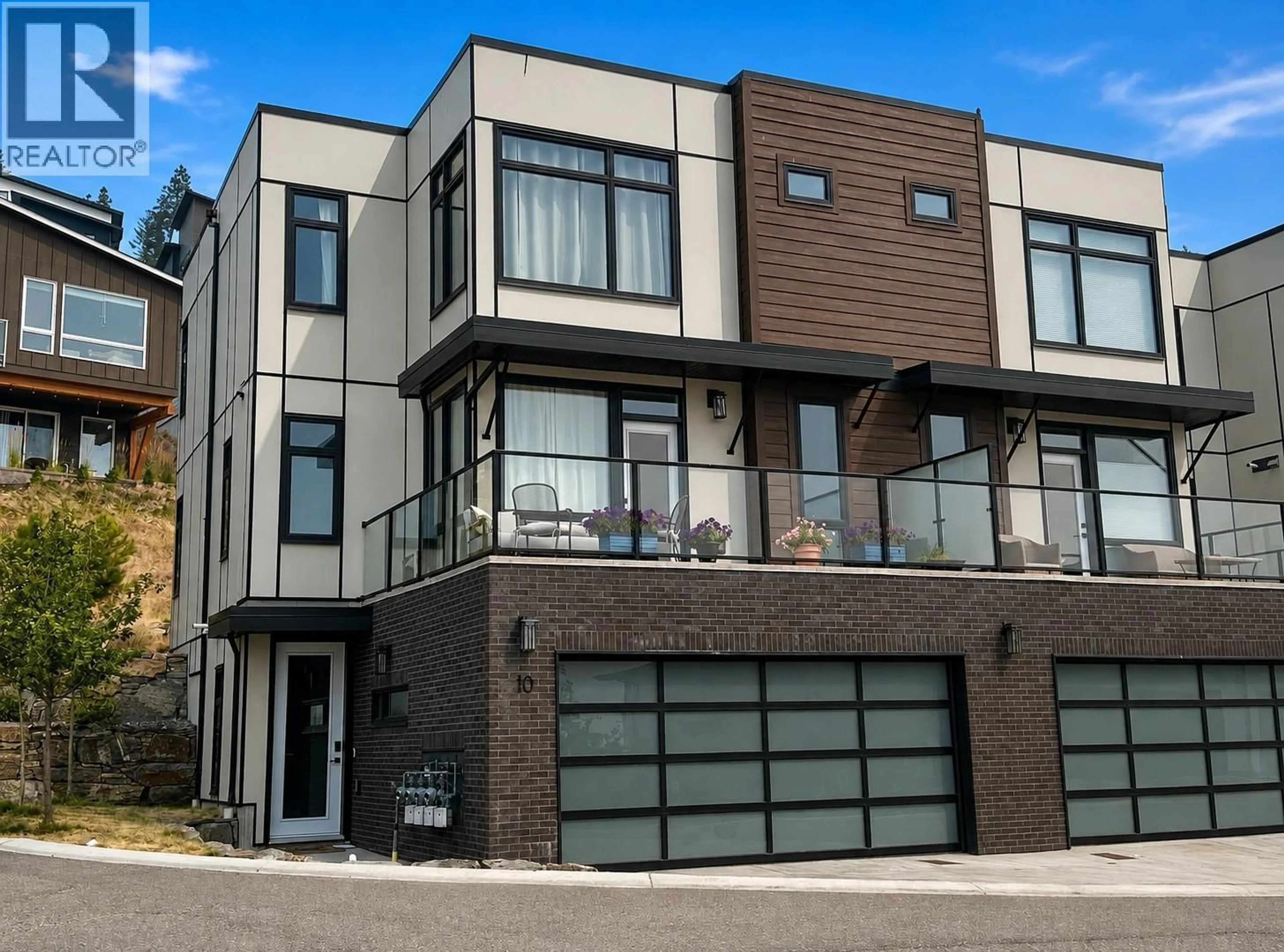 Home with brick exterior material, street for 10 - 3220 HILLTOWN DRIVE, Kelowna British Columbia V1V0C6