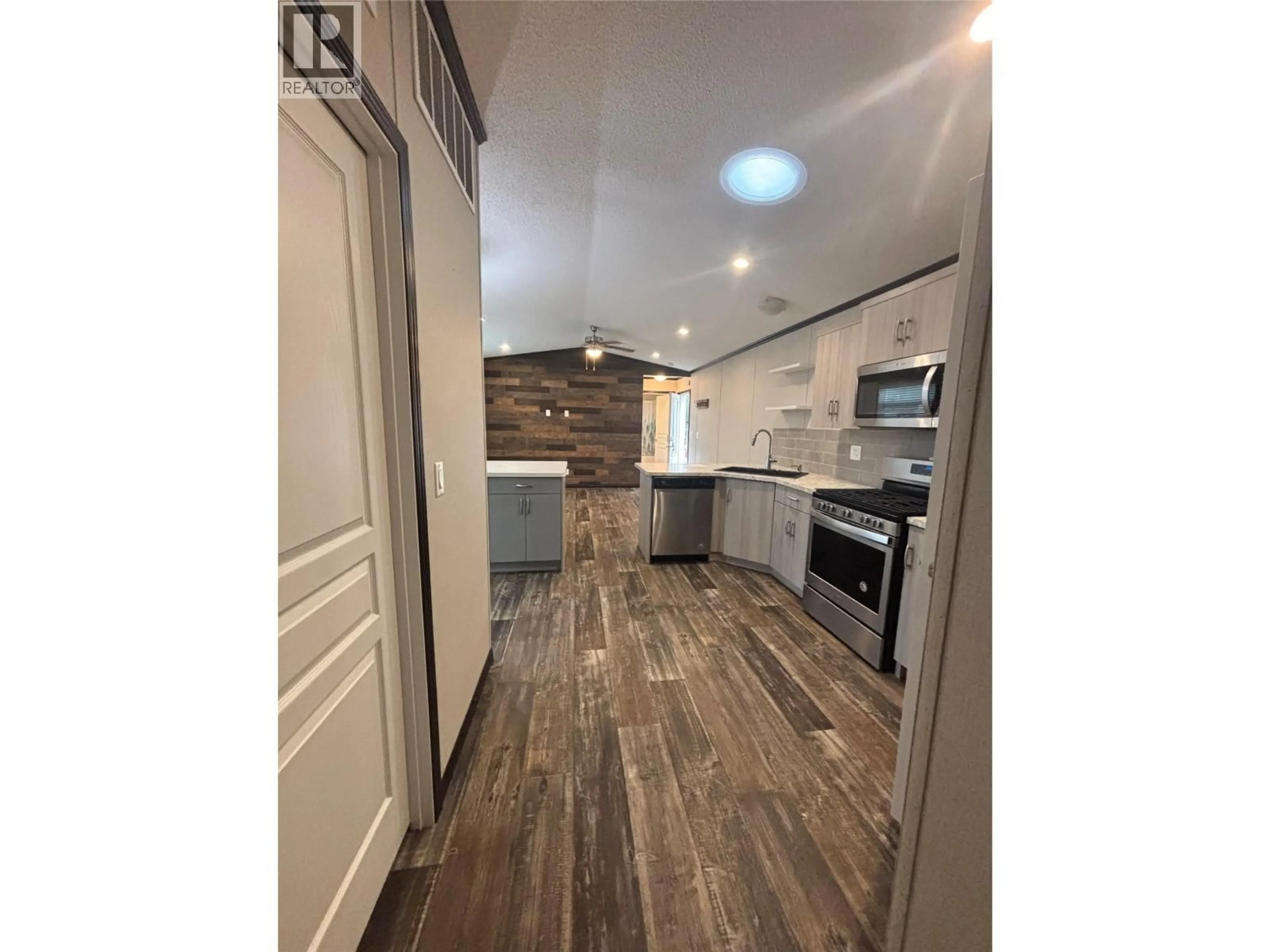 Open concept kitchen, wood/laminate floor for 47 - 1133 FINDLAY ROAD, Kelowna British Columbia V1X5A9