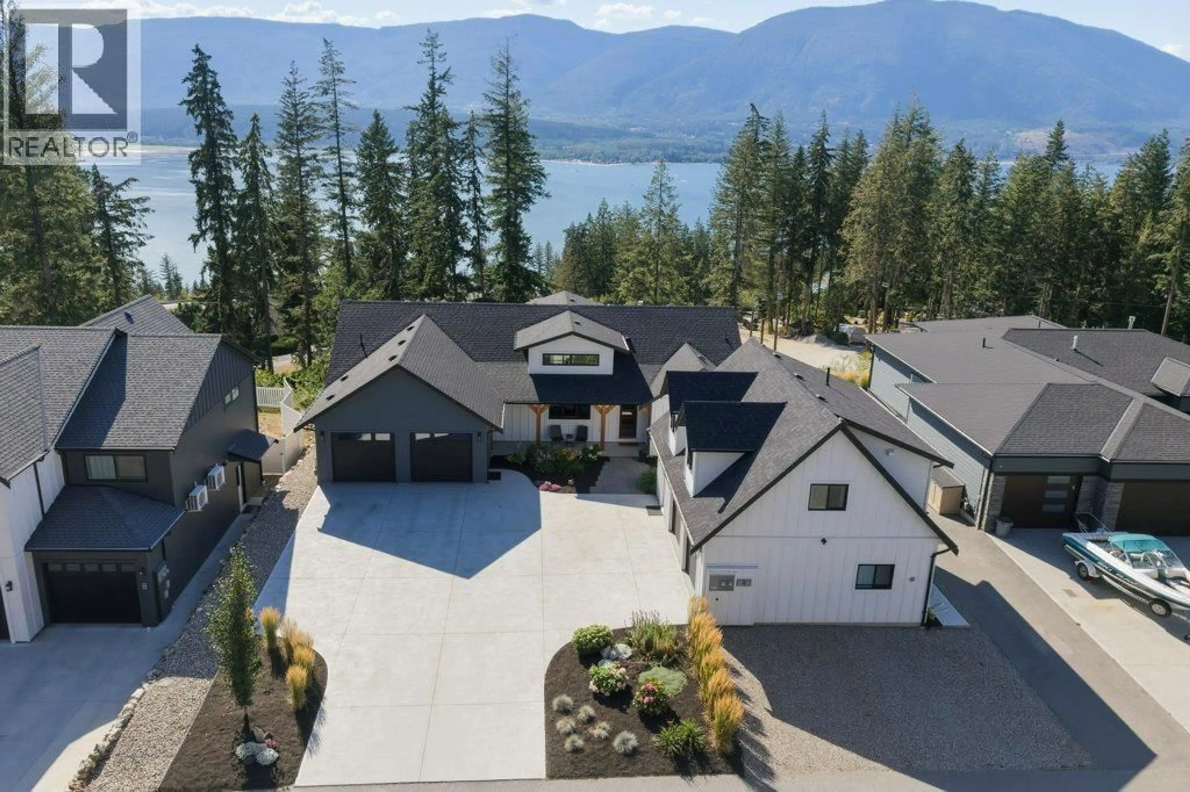 A pic from outside/outdoor area/front of a property/back of a property/a pic from drone, mountain view for 8 - 3820 20 STREET NORTHEAST, Salmon Arm British Columbia V1E0G7