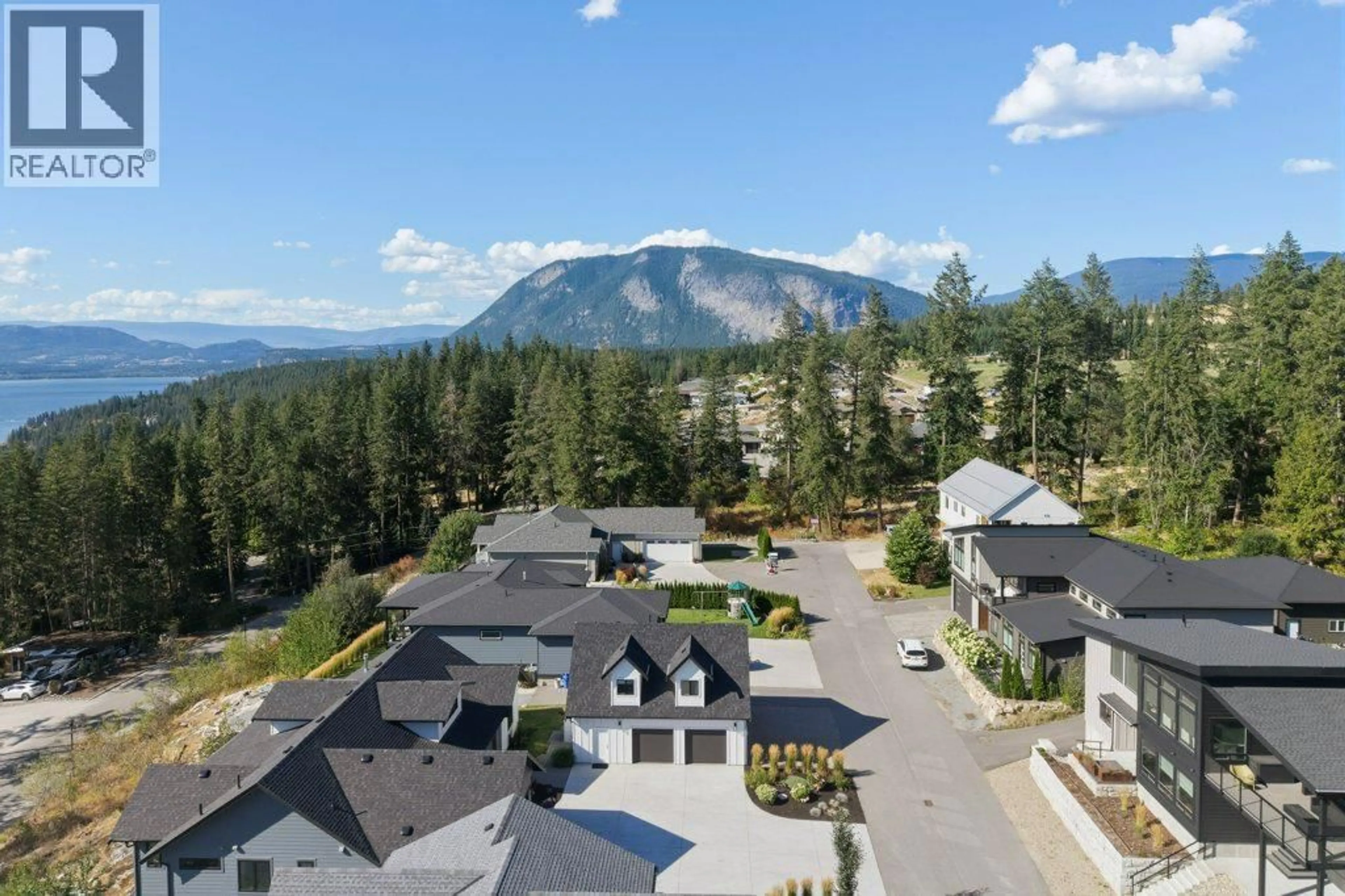 A pic from outside/outdoor area/front of a property/back of a property/a pic from drone, mountain view for 8 - 3820 20 STREET NORTHEAST, Salmon Arm British Columbia V1E0G7