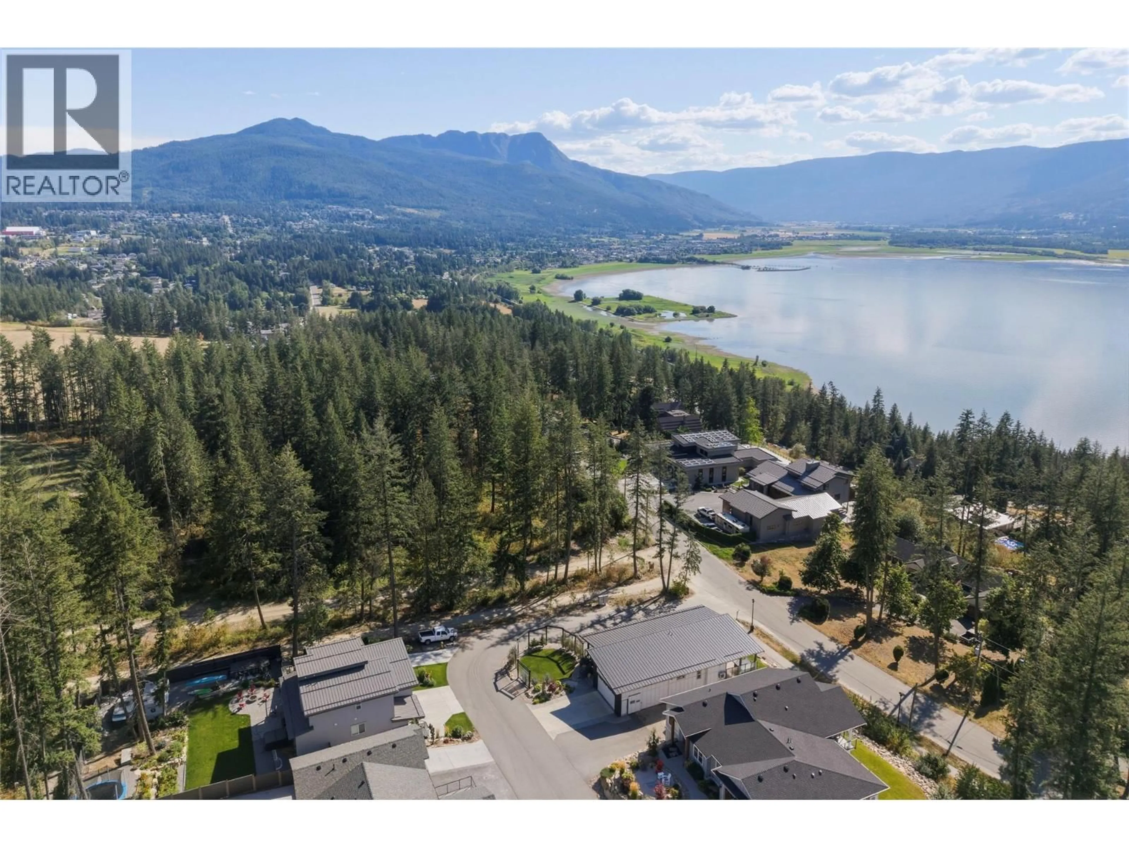 A pic from outside/outdoor area/front of a property/back of a property/a pic from drone, mountain view for 8 - 3820 20 STREET NORTHEAST, Salmon Arm British Columbia V1E0G7