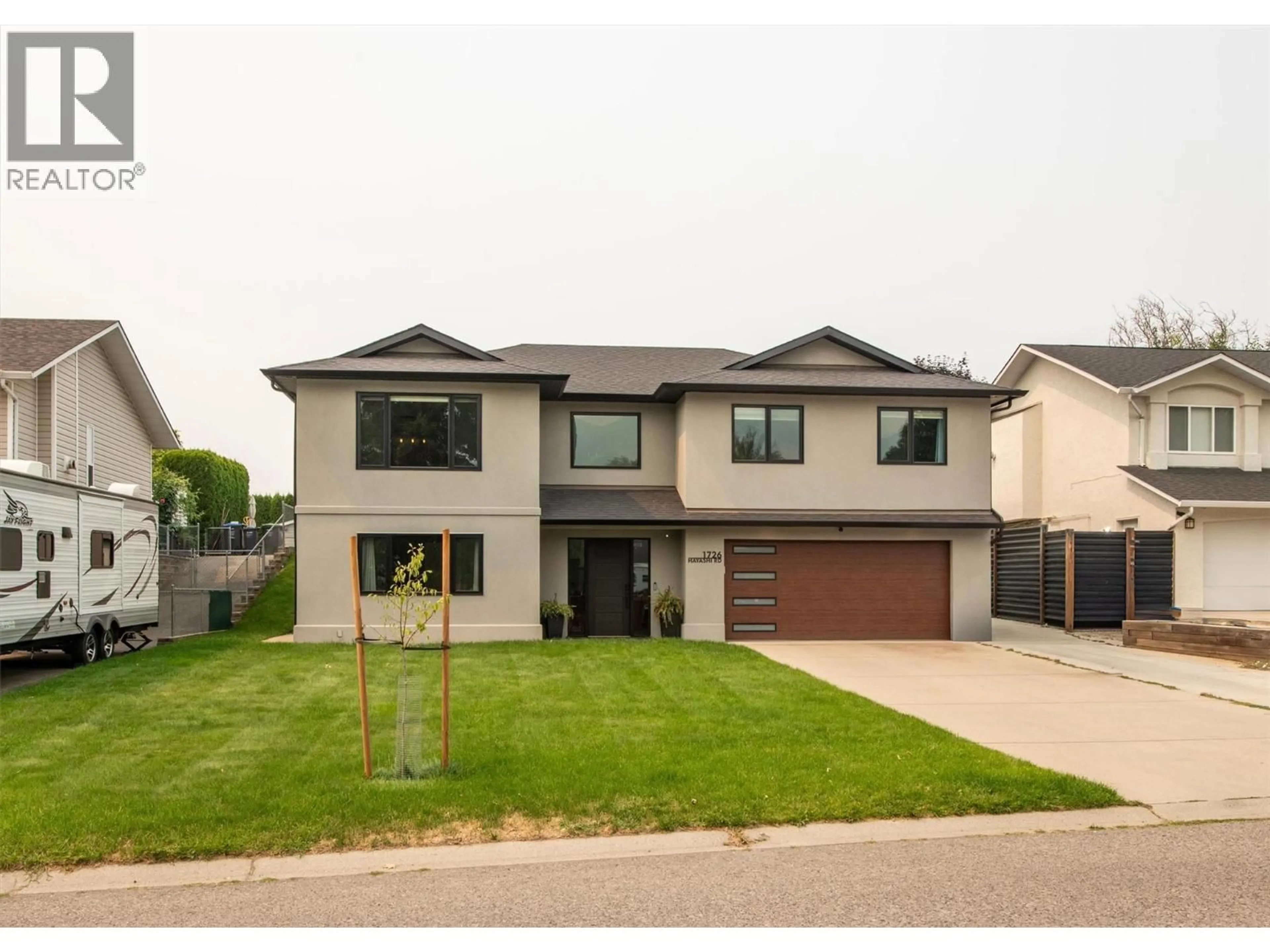 Home with brick exterior material, street for 1726 HAYASHI ROAD, Kelowna British Columbia V1P1B2