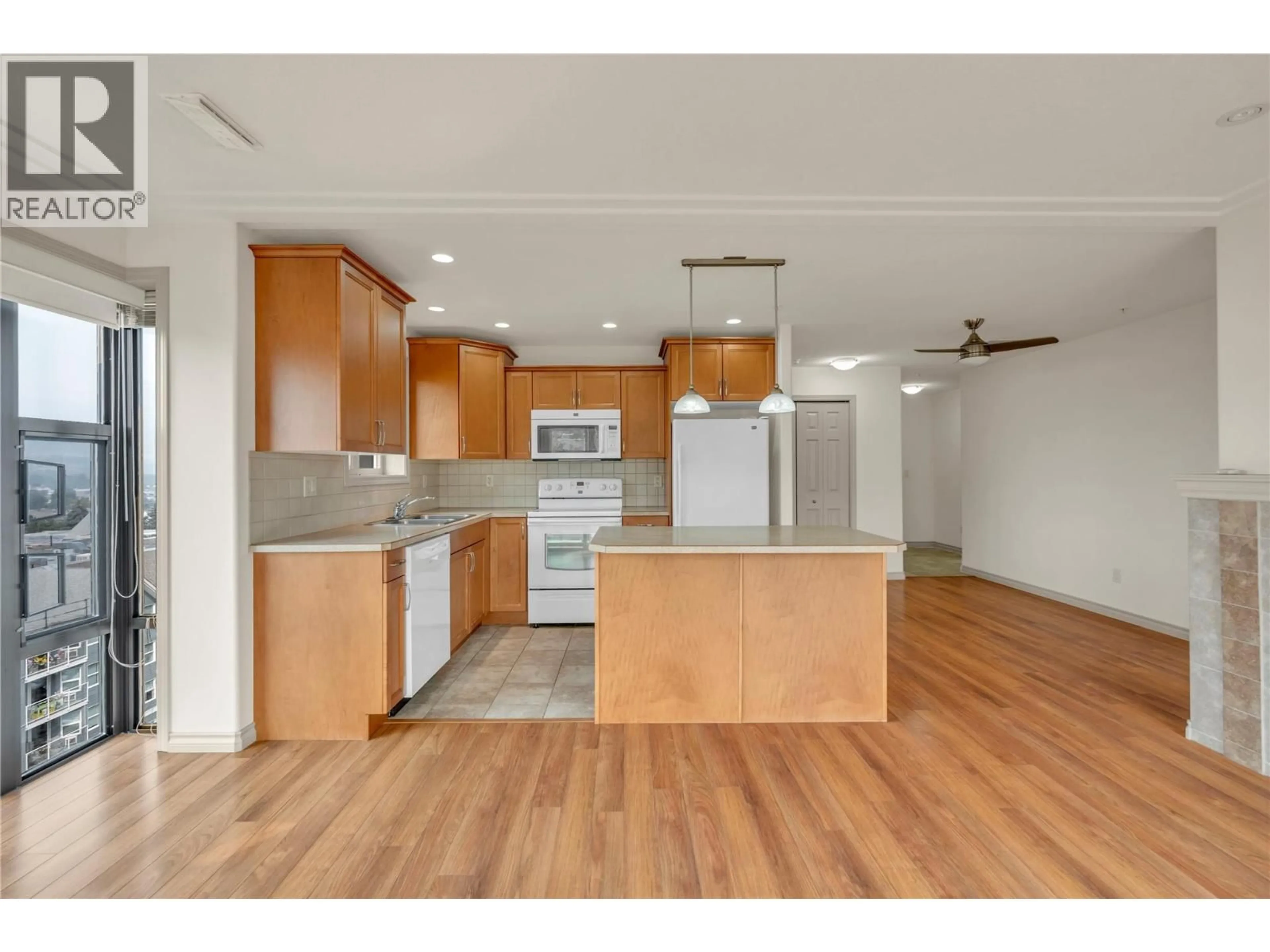 Open concept kitchen, wood/laminate floor for 705 - 2125 ATKINSON STREET, Penticton British Columbia V2A9E6