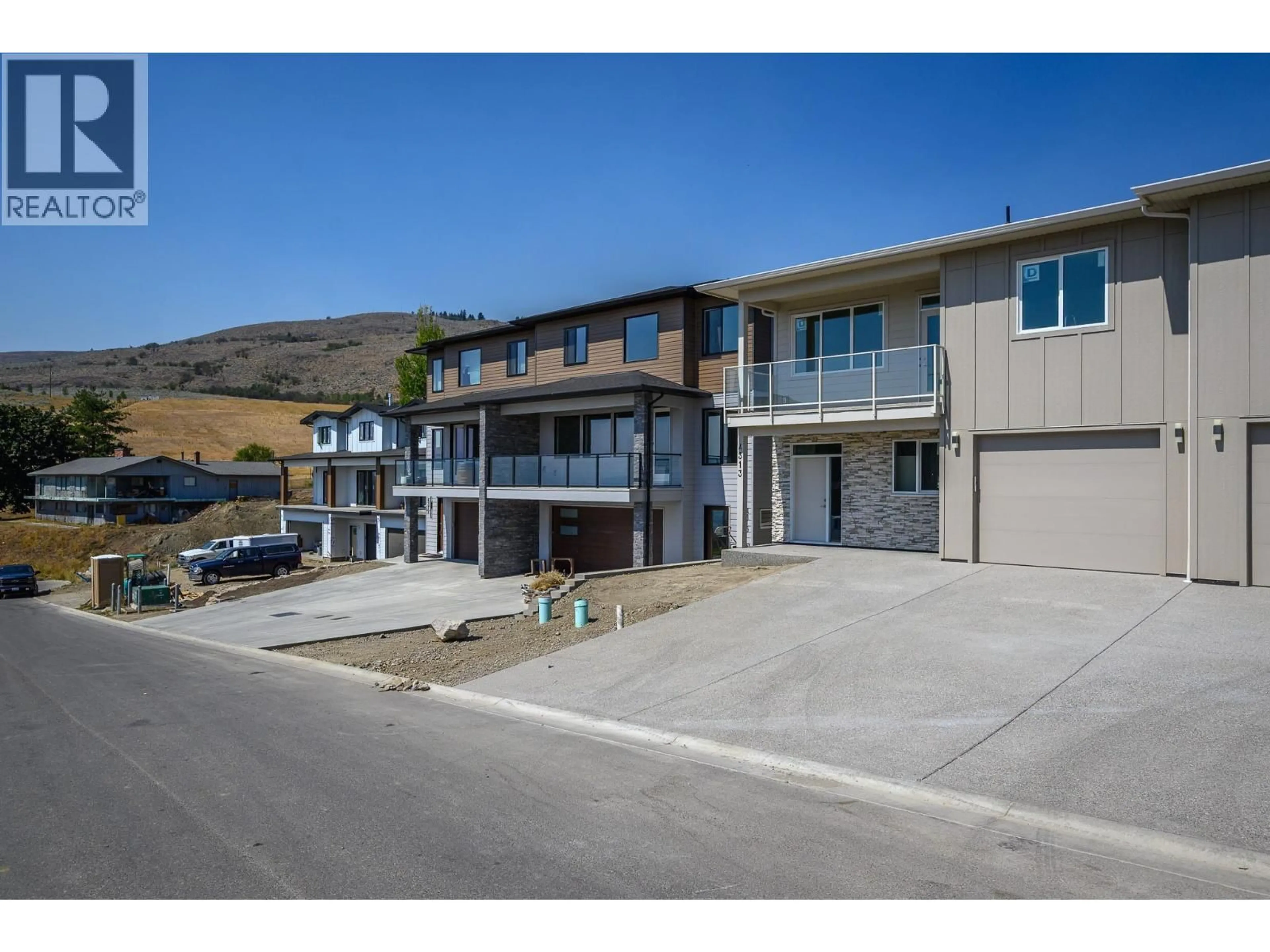 A pic from outside/outdoor area/front of a property/back of a property/a pic from drone, mountain view for 4313 PAINTED TURTLE DRIVE, Vernon British Columbia V1H1A2