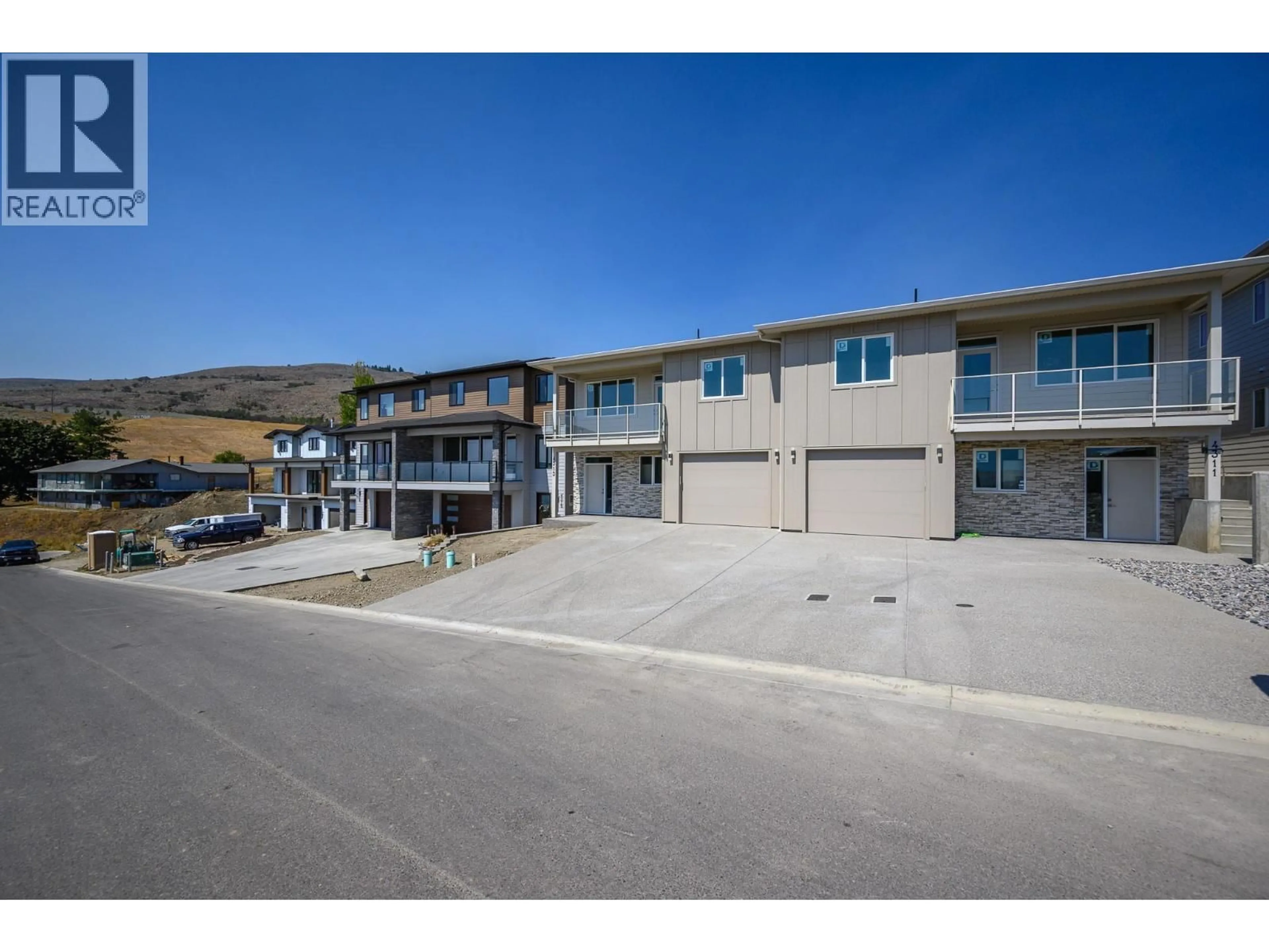A pic from outside/outdoor area/front of a property/back of a property/a pic from drone, mountain view for 4313 PAINTED TURTLE DRIVE, Vernon British Columbia V1H1A2