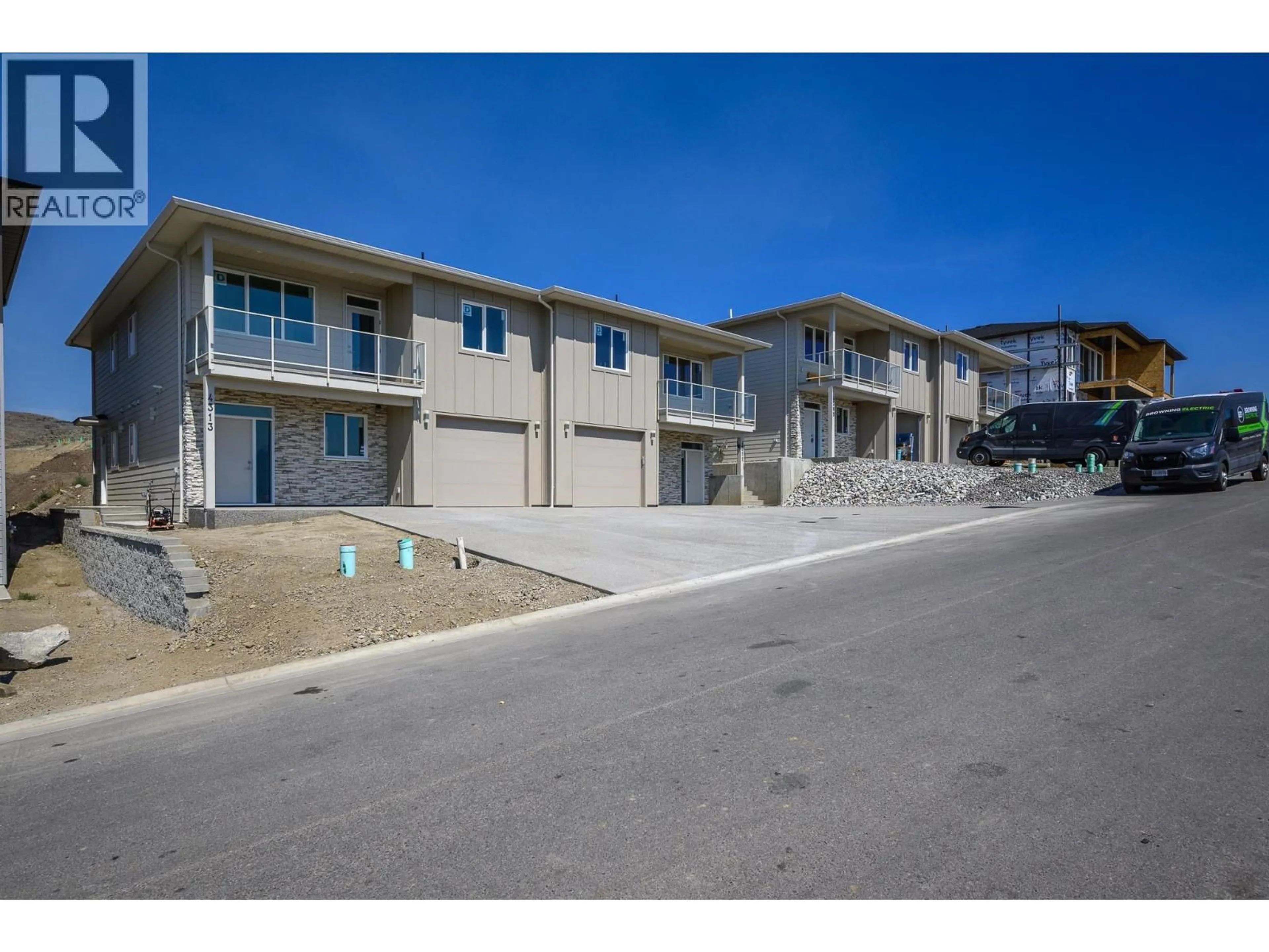 A pic from outside/outdoor area/front of a property/back of a property/a pic from drone, street for 4313 PAINTED TURTLE DRIVE, Vernon British Columbia V1H1A2