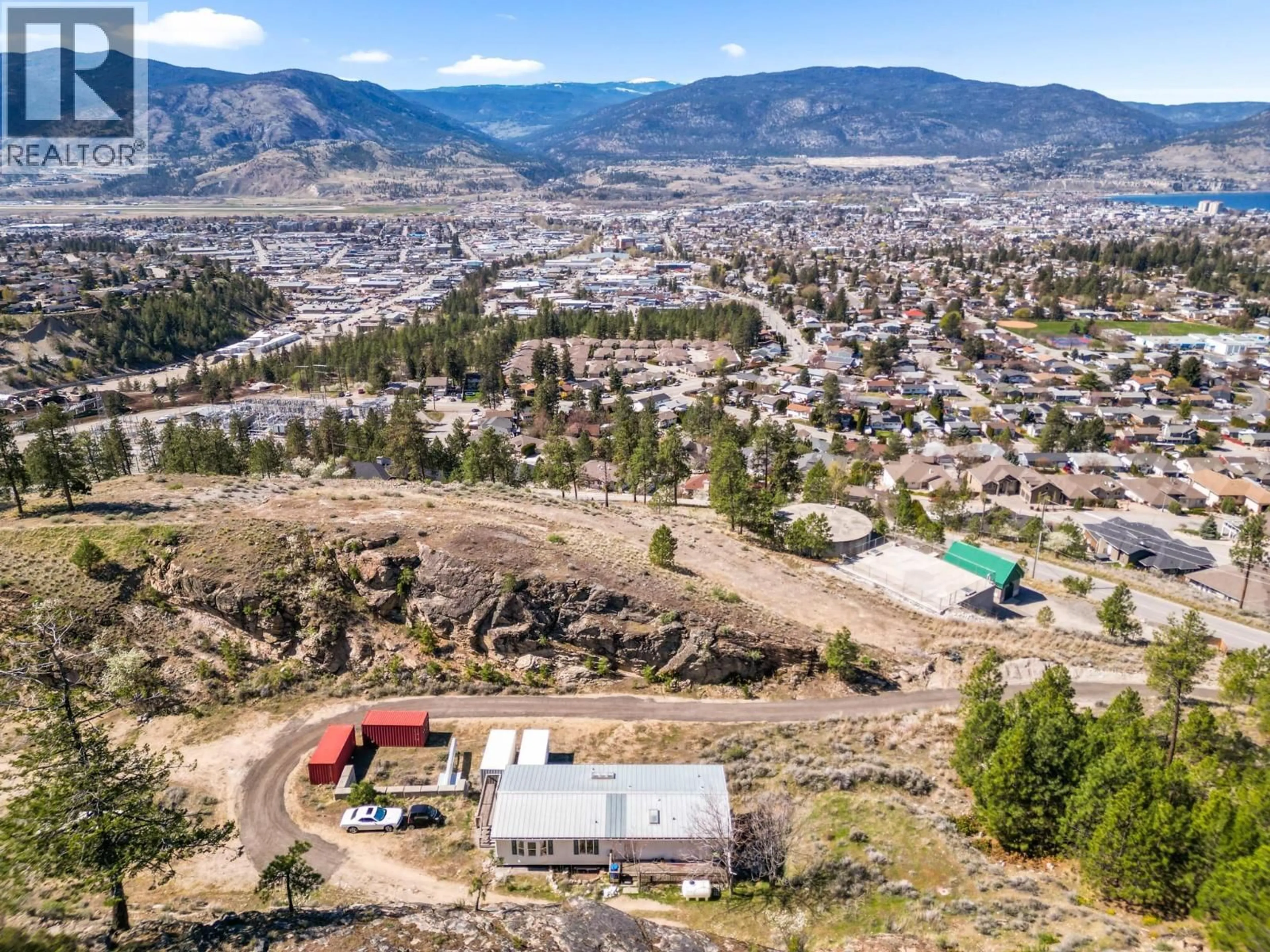 A pic from outside/outdoor area/front of a property/back of a property/a pic from drone, mountain view for 138 SALIKEN DRIVE, Penticton British Columbia V2A8V6