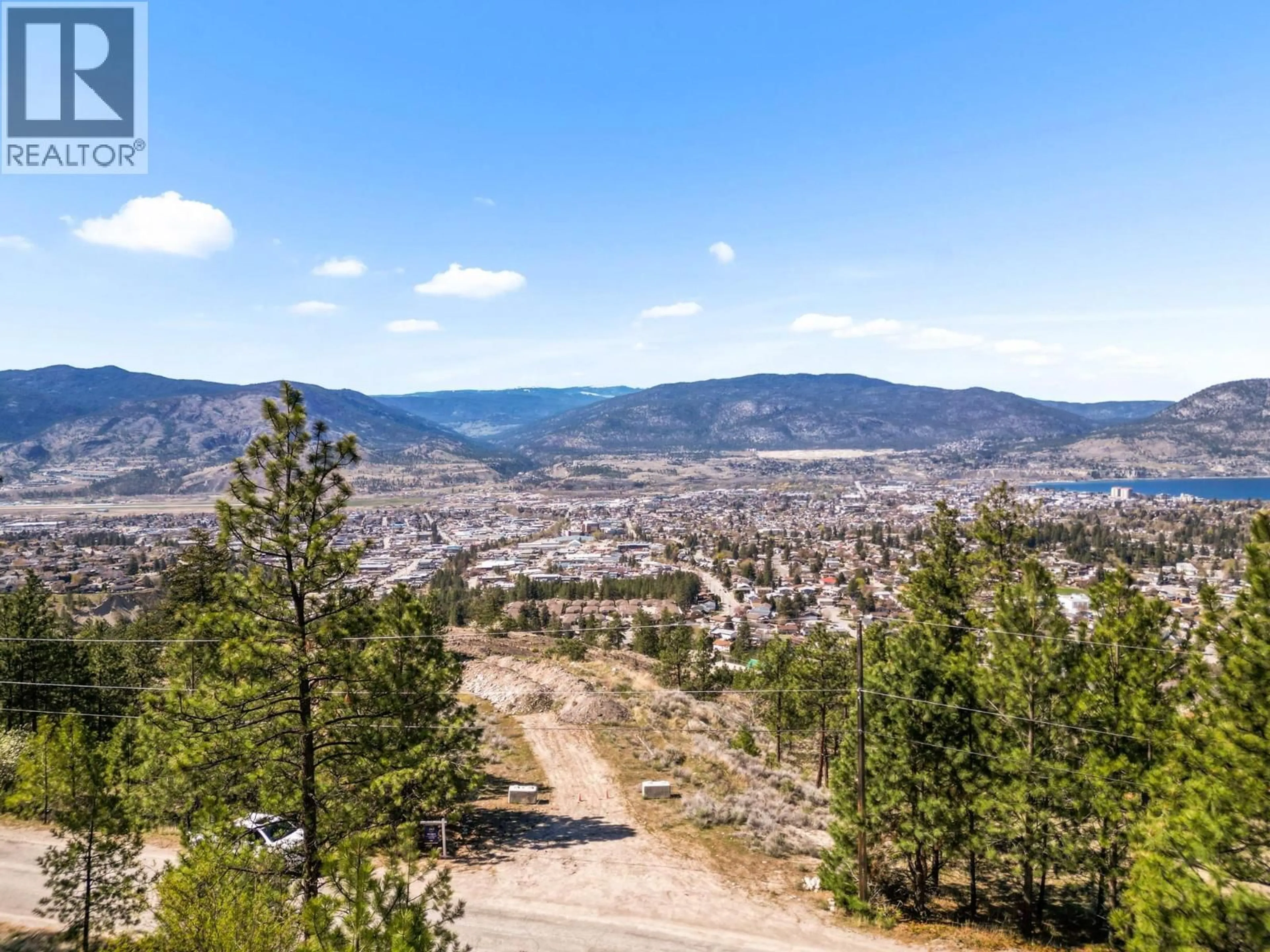 A pic from outside/outdoor area/front of a property/back of a property/a pic from drone, mountain view for 138 SALIKEN DRIVE, Penticton British Columbia V2A8V6