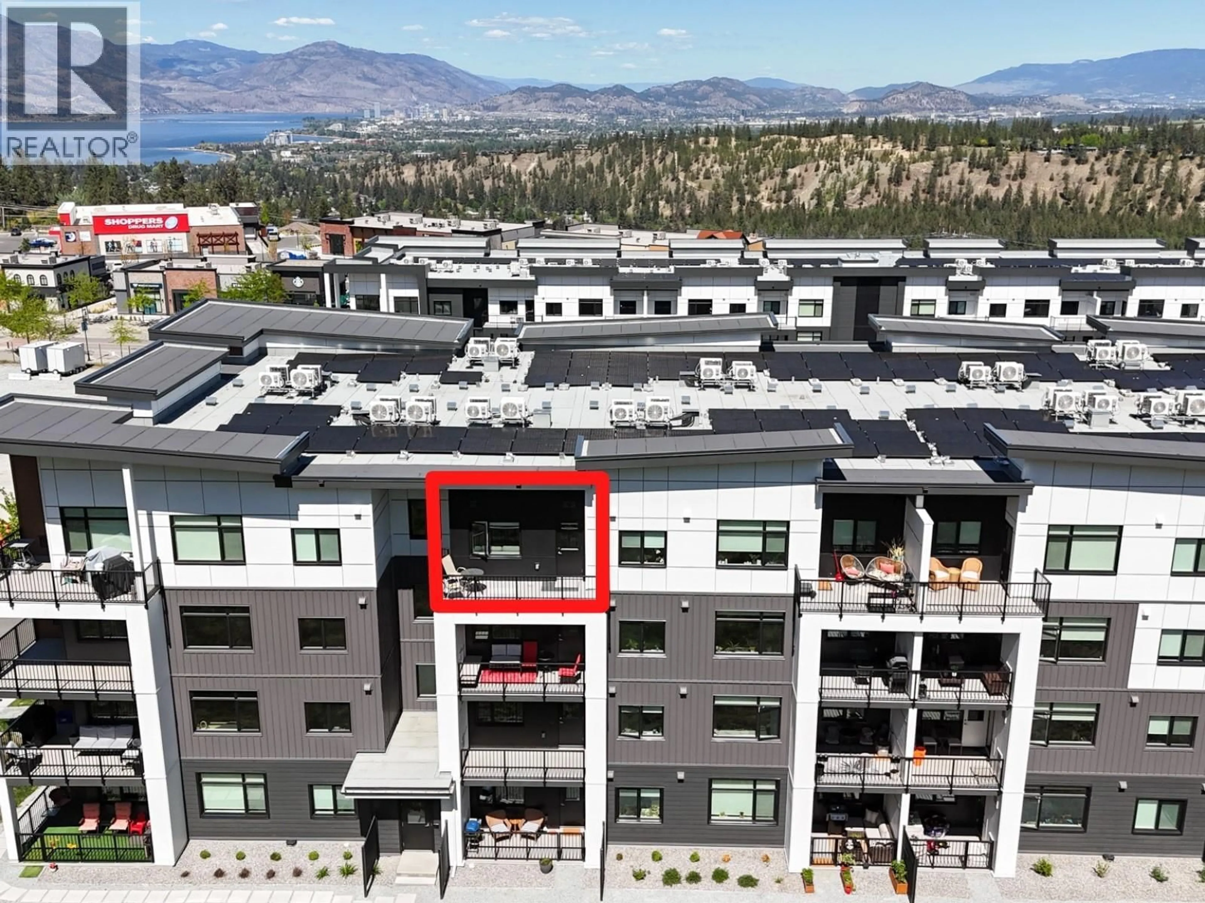 A pic from outside/outdoor area/front of a property/back of a property/a pic from drone, mountain view for 404 - 1057 FROST ROAD, Kelowna British Columbia V1W0G7