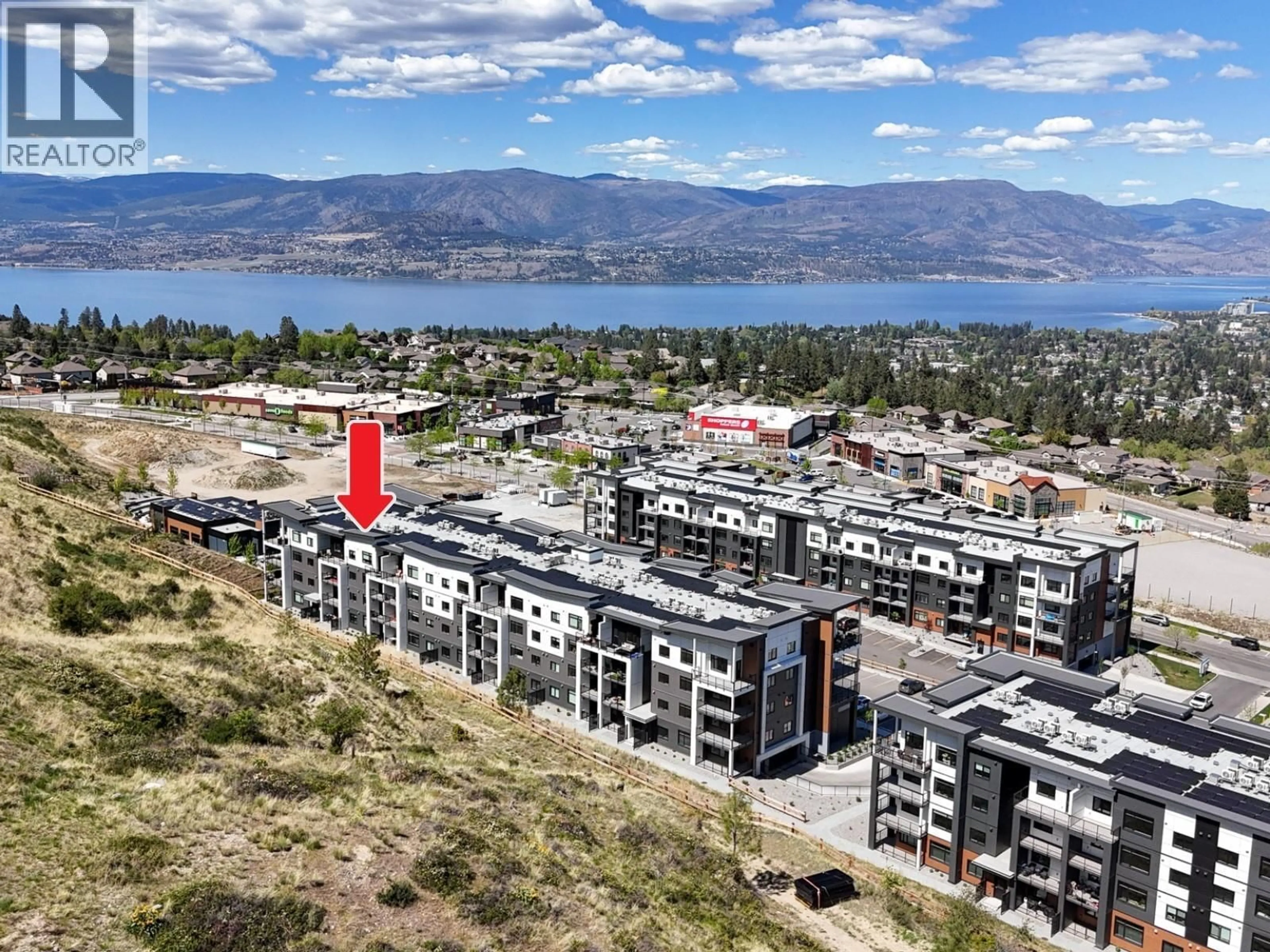 A pic from outside/outdoor area/front of a property/back of a property/a pic from drone, mountain view for 404 - 1057 FROST ROAD, Kelowna British Columbia V1W0G7
