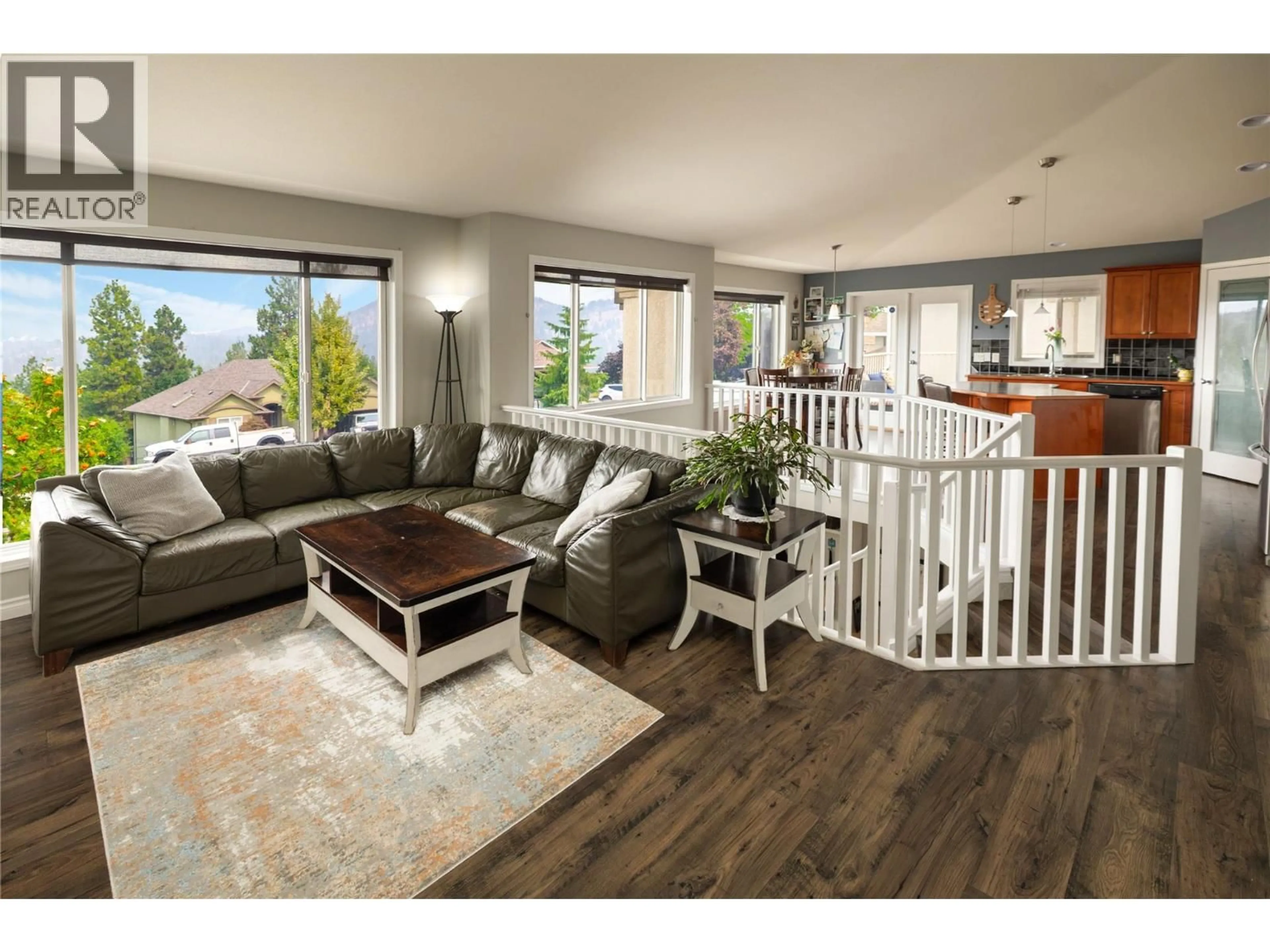 Living room with furniture, wood/laminate floor for 3013 BRINDISI PLACE, Kelowna British Columbia V1V2N5