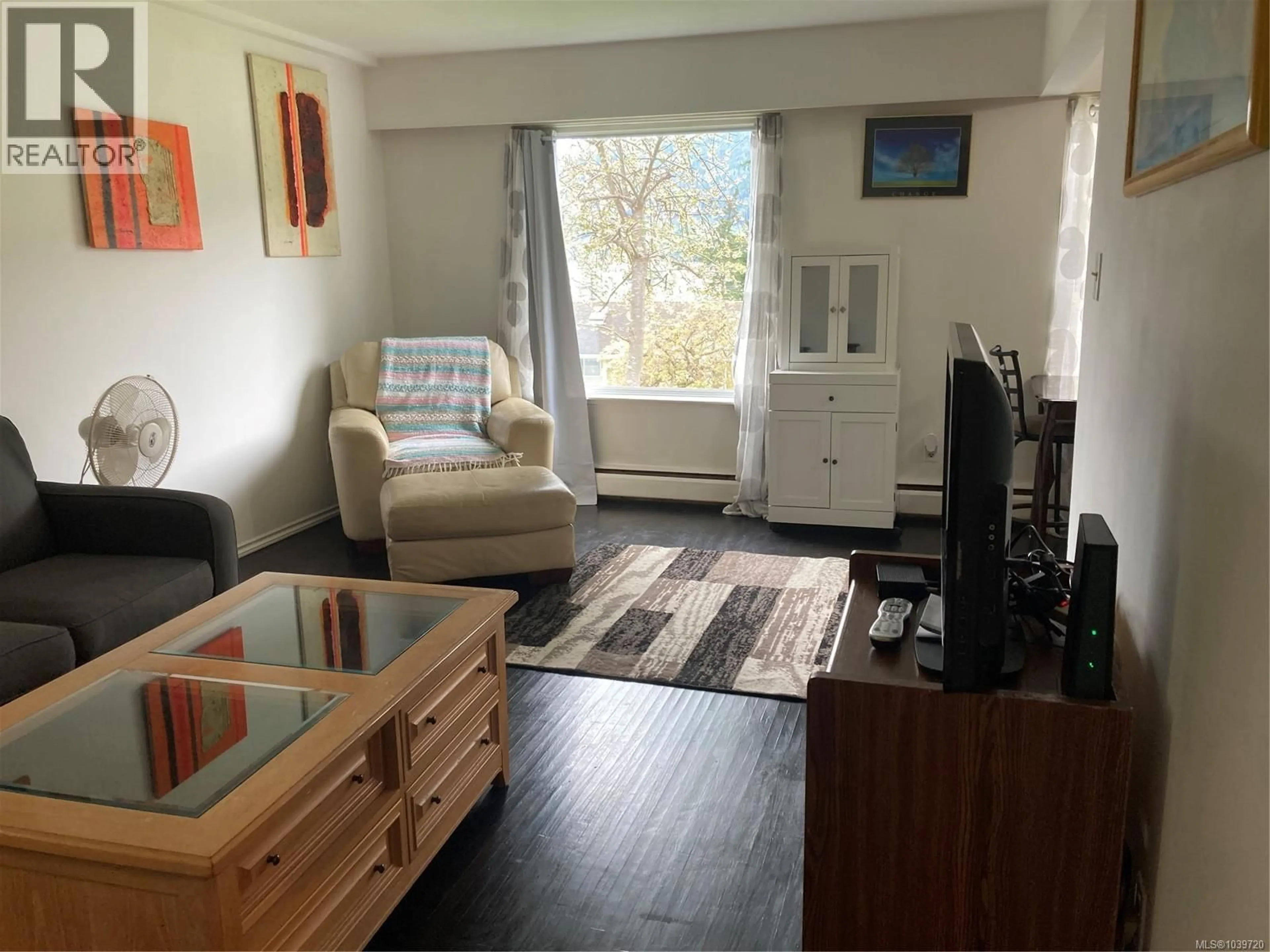 Living room with furniture, wood/laminate floor for 405 - 1083 MAQUINNA AVENUE, Port Alice British Columbia V0N2N0