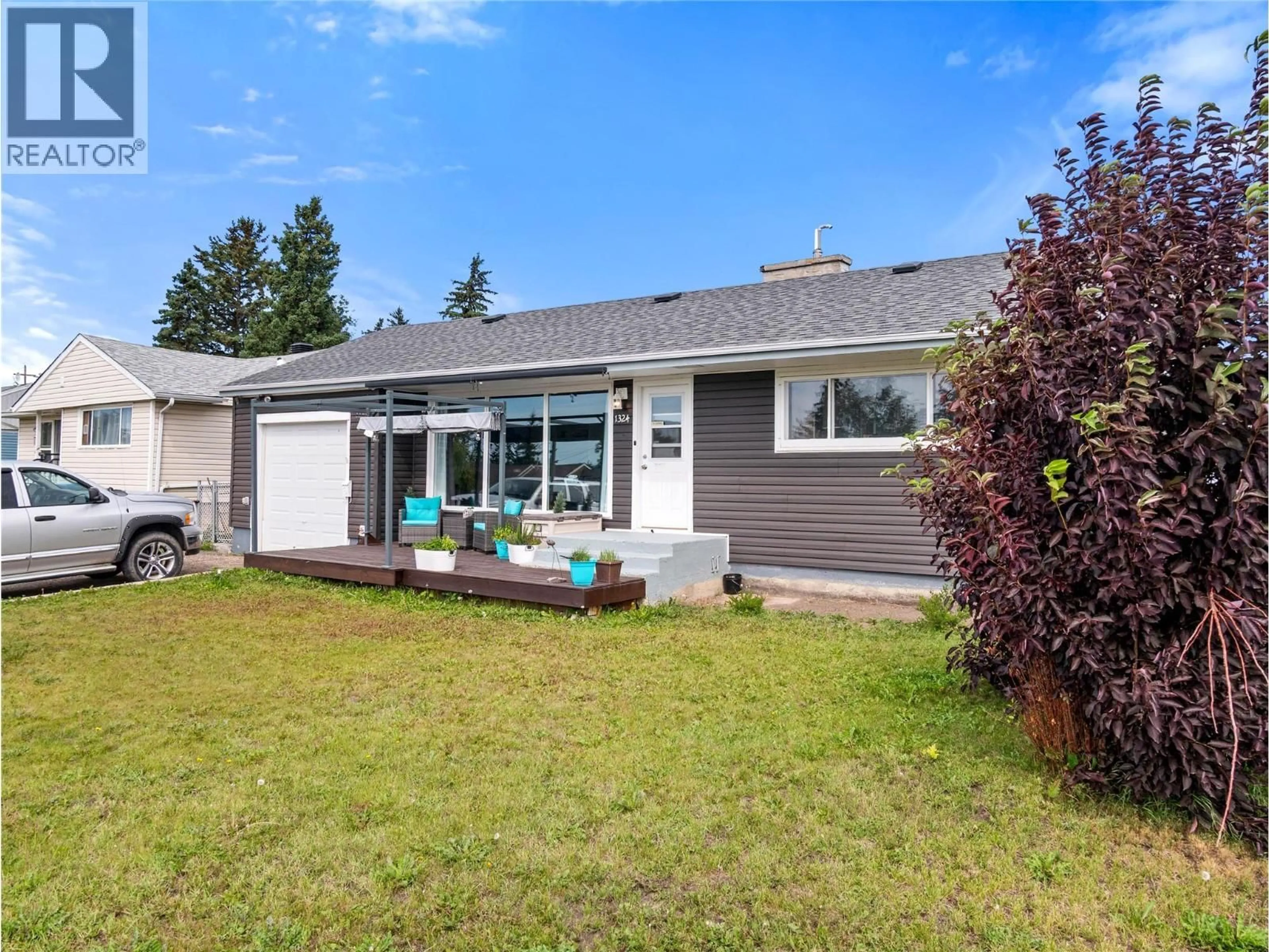 Home with vinyl exterior material, street for 1324 93 AVENUE, Dawson Creek British Columbia V1G1E4