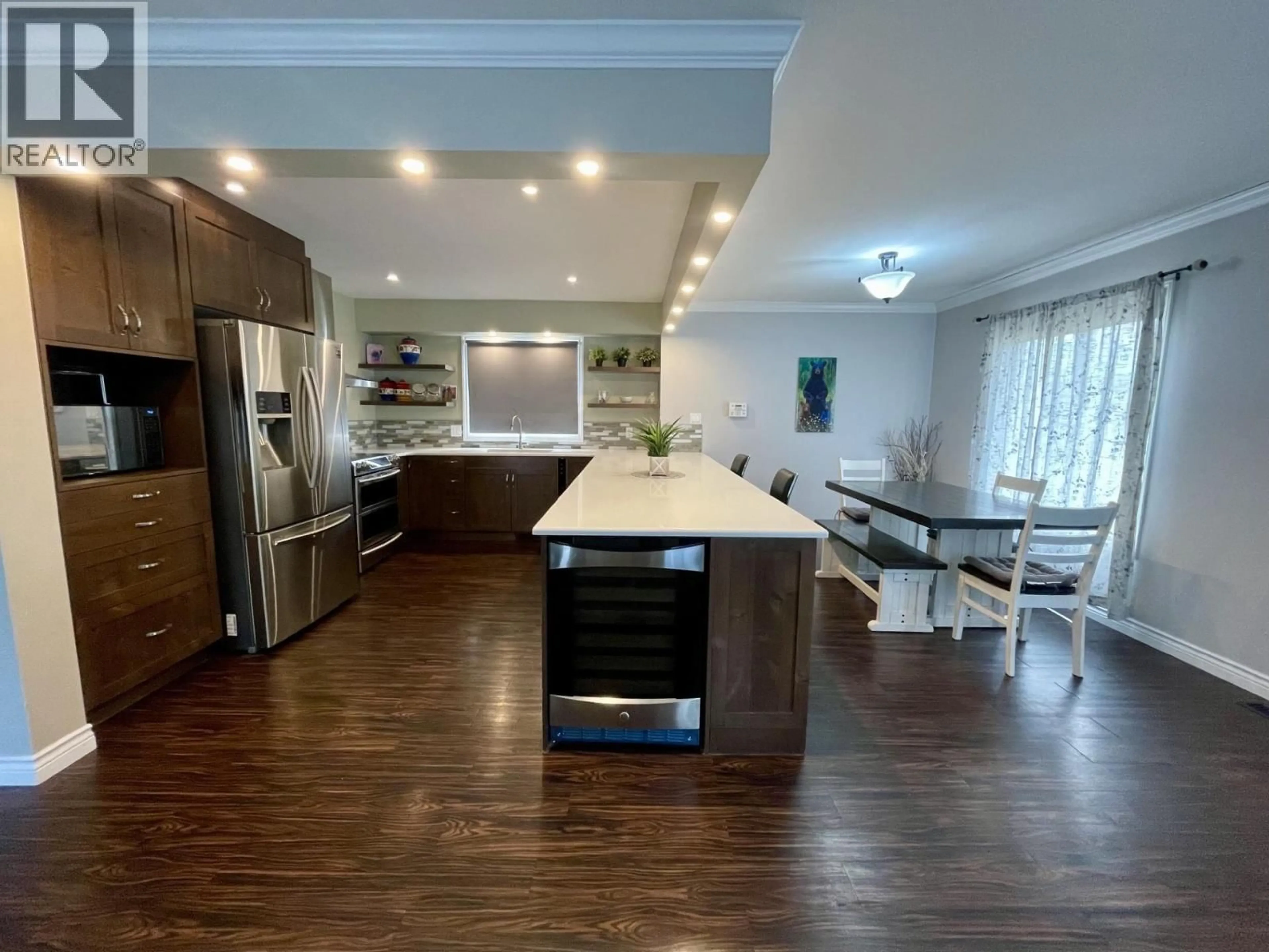 Open concept kitchen, wood/laminate floor for 1277 PINYON ROAD, Sparwood British Columbia V0B2G2