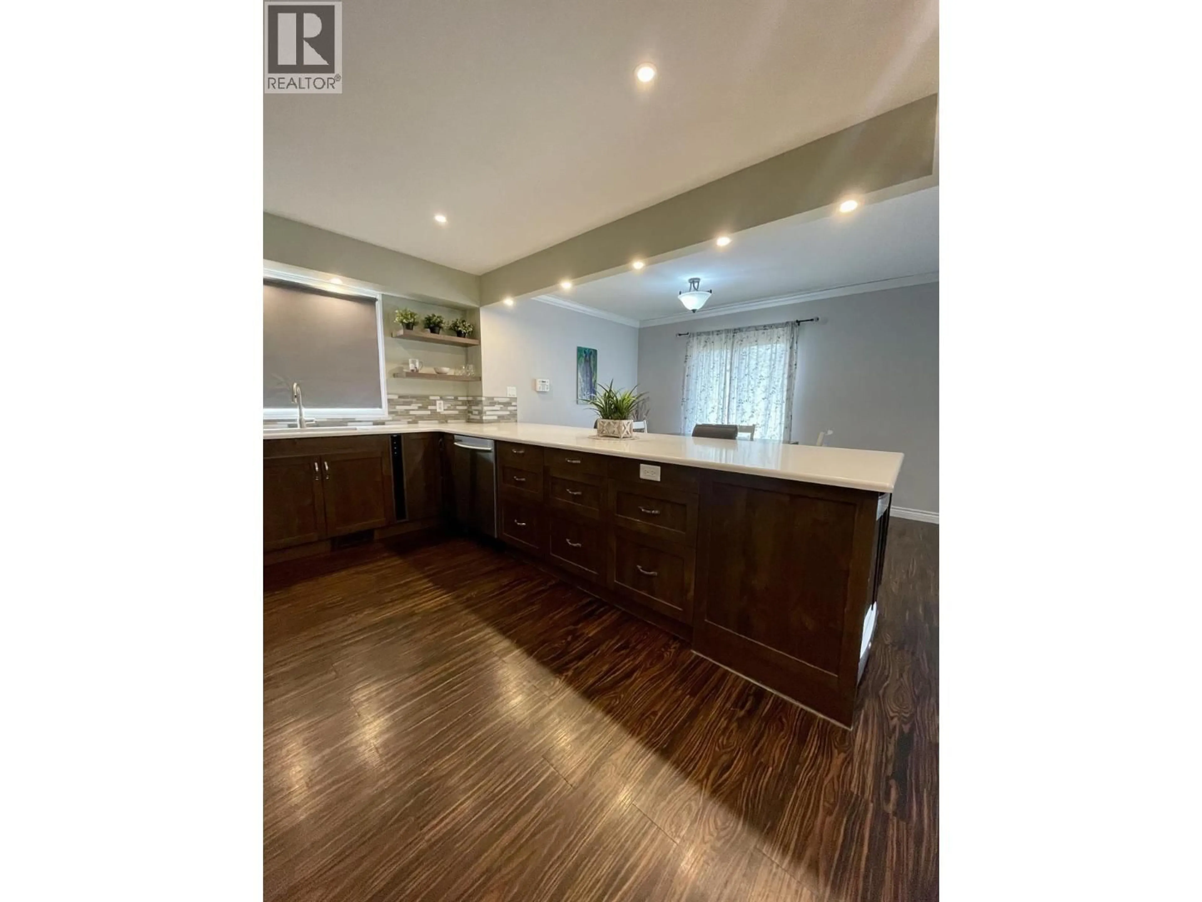 Open concept kitchen, wood/laminate floor for 1277 PINYON ROAD, Sparwood British Columbia V0B2G2