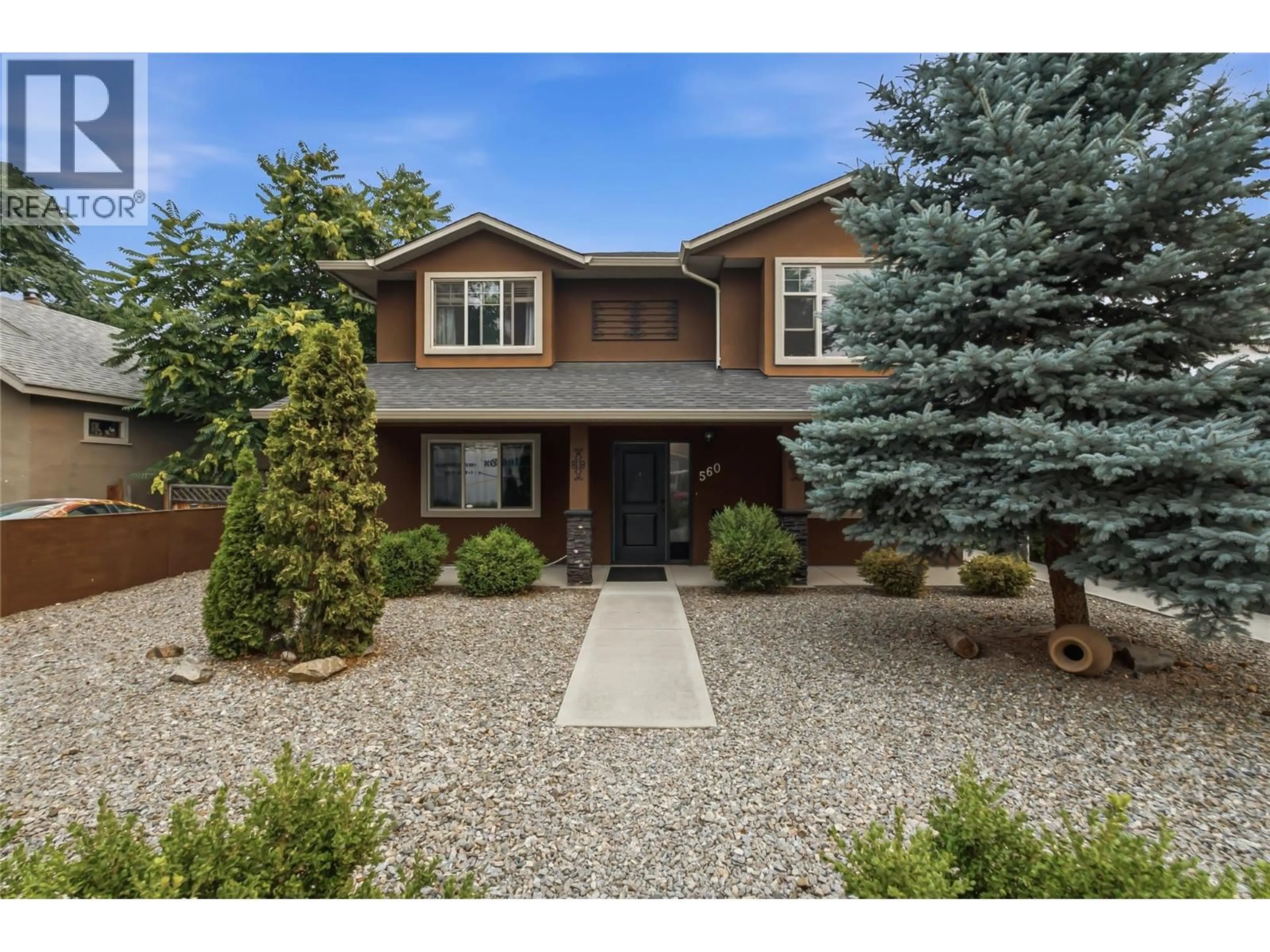 Home with brick exterior material, street for 560 CHRISTLETON AVENUE, Kelowna British Columbia V1Y5J2