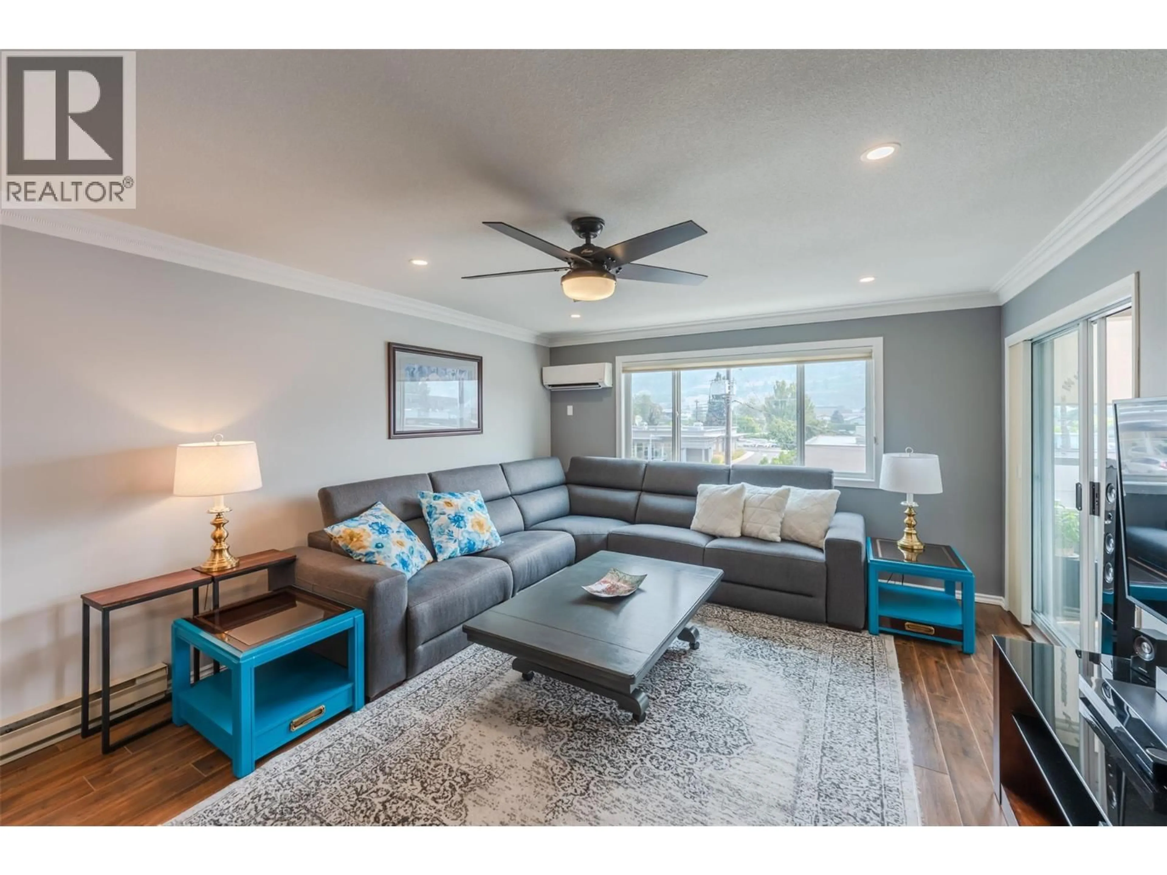 Living room with furniture, wood/laminate floor for 311 - 272 GREEN AVENUE, Penticton British Columbia V2A3T2