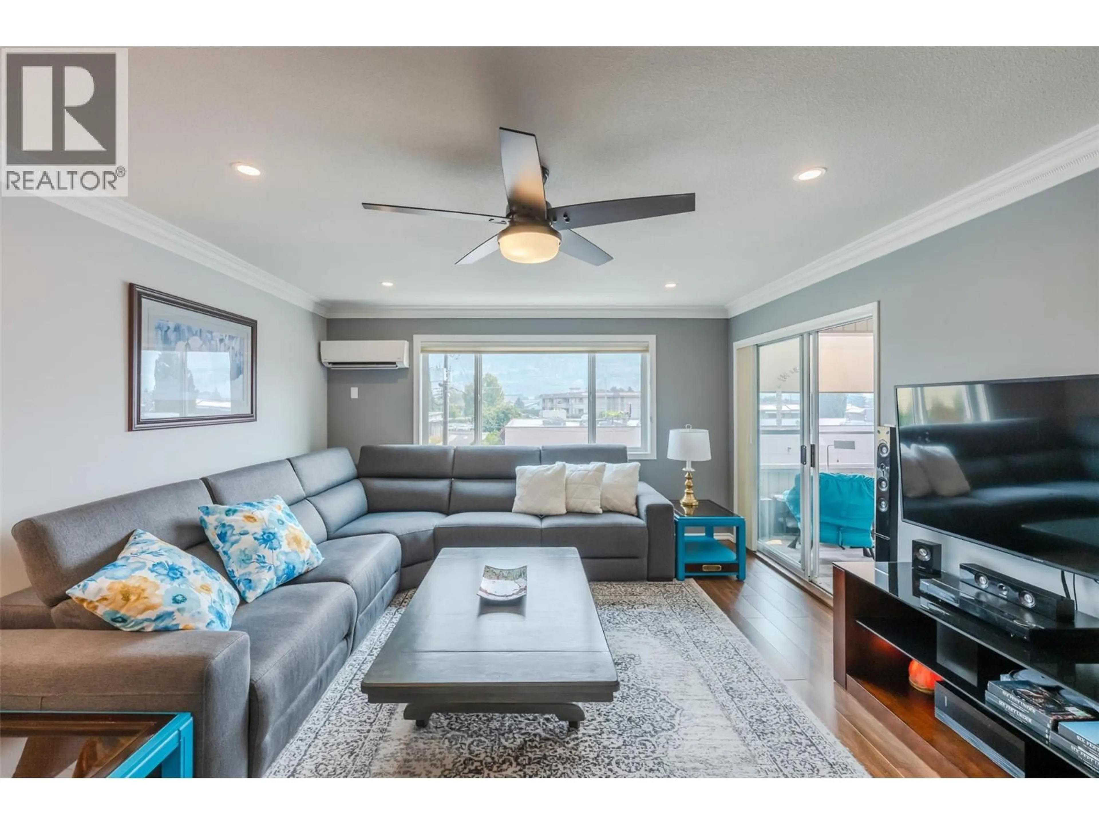 Living room with furniture, wood/laminate floor for 311 - 272 GREEN AVENUE, Penticton British Columbia V2A3T2