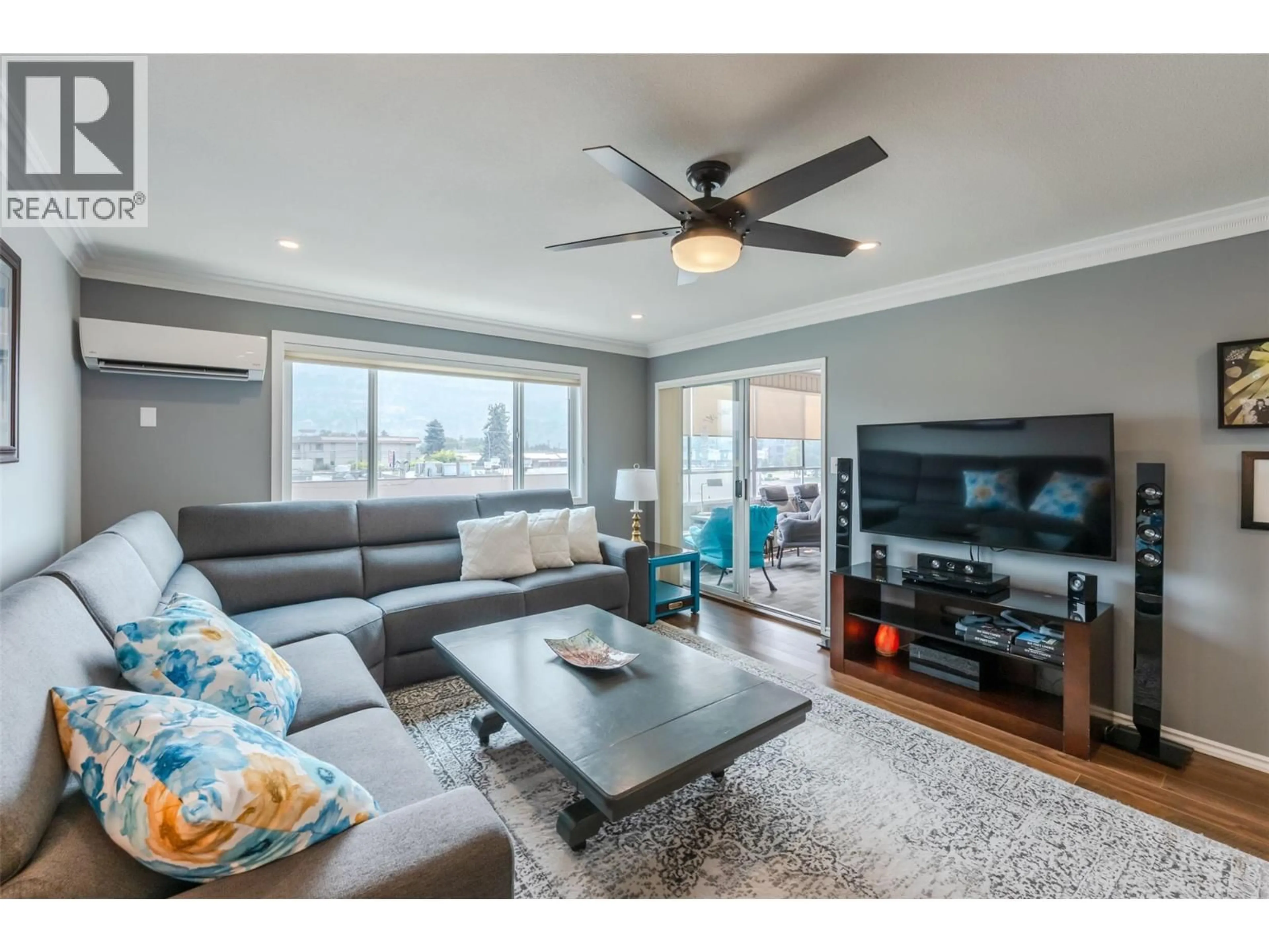 Living room with furniture, wood/laminate floor for 311 - 272 GREEN AVENUE, Penticton British Columbia V2A3T2