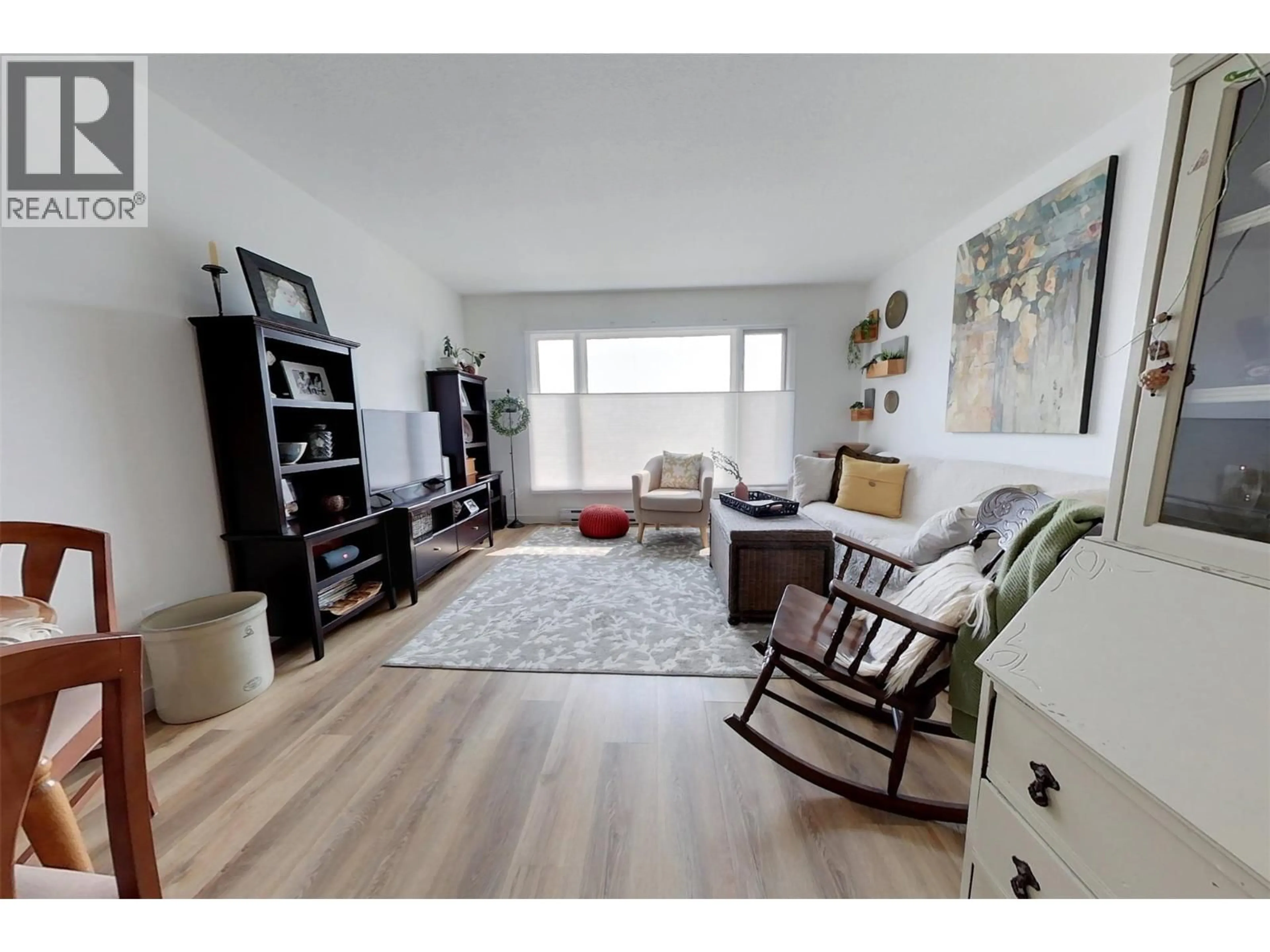 Living room with furniture, wood/laminate floor for 1740 HILLSIDE STREET, Creston British Columbia V0B1G5